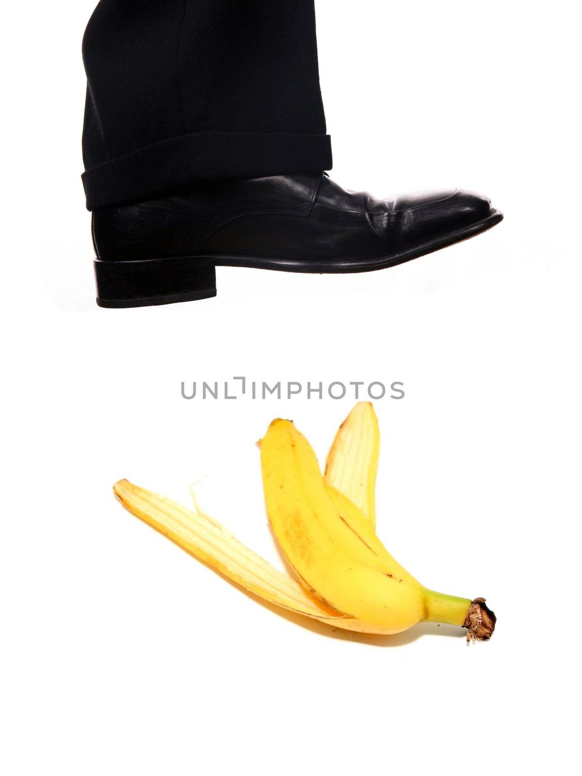 businessman shoe steping a banana