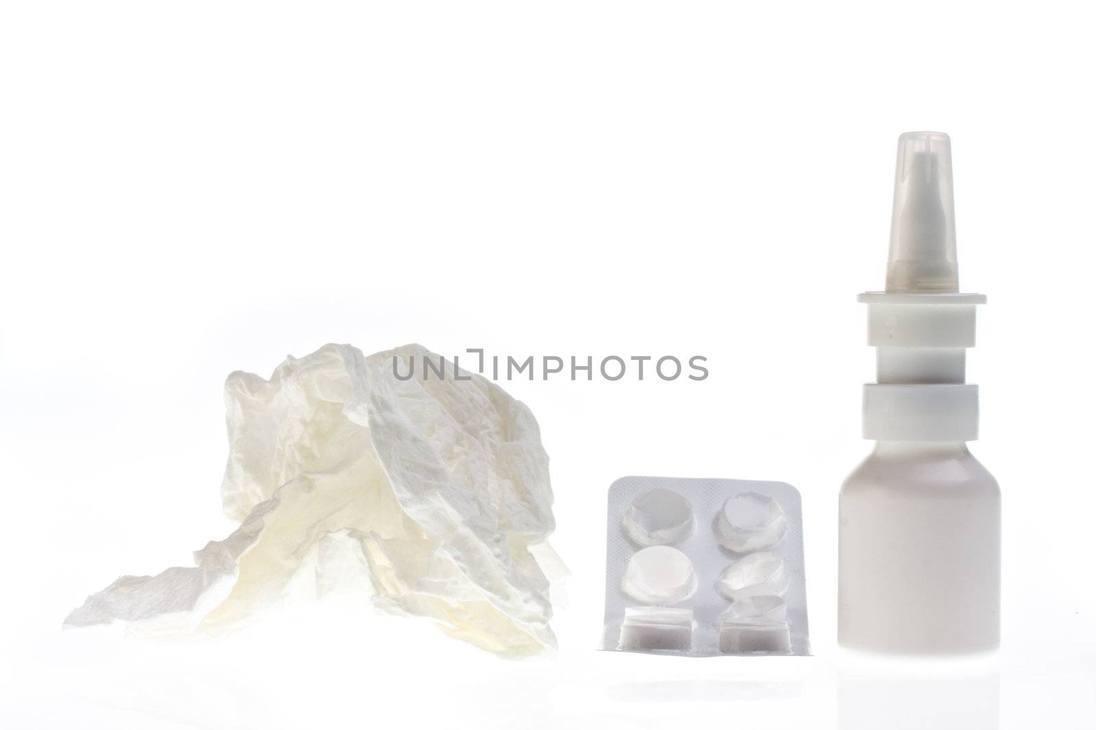 nasal spray, blister and handkerchief isolated on white