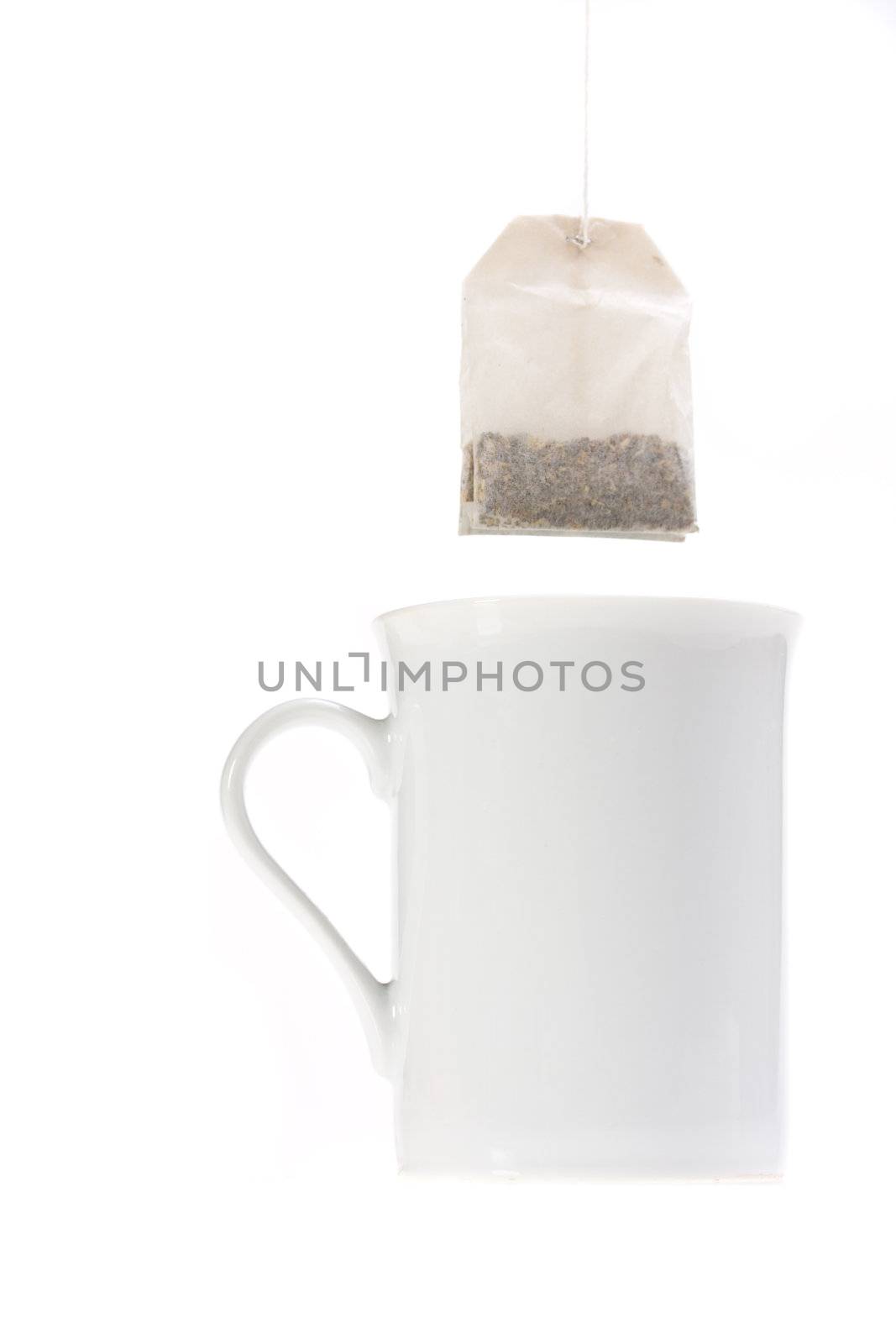 teabag and a white cup isolated on white background by bernjuer