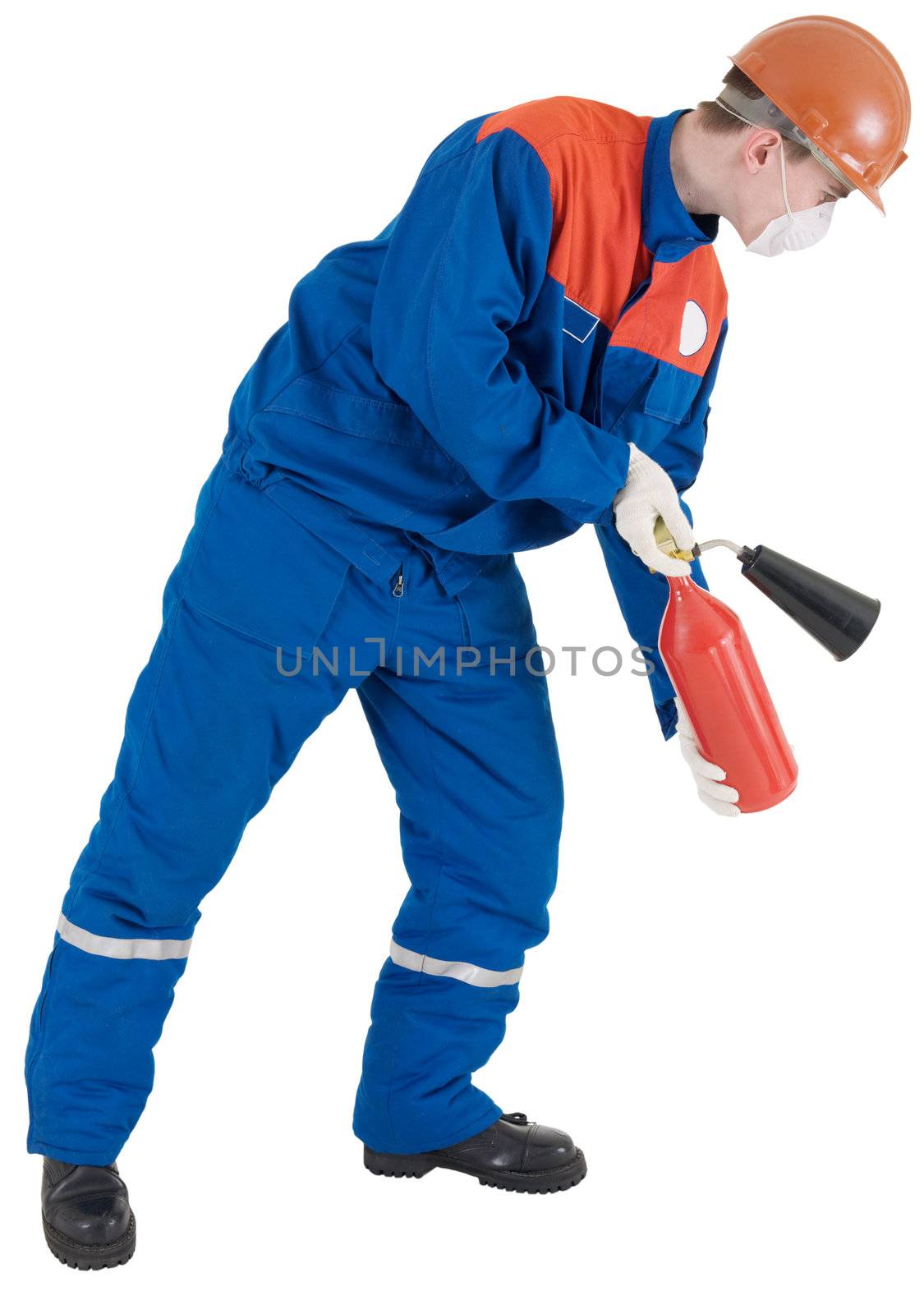 Man in worker to cloth and helmet with fire-extinguisher in hands