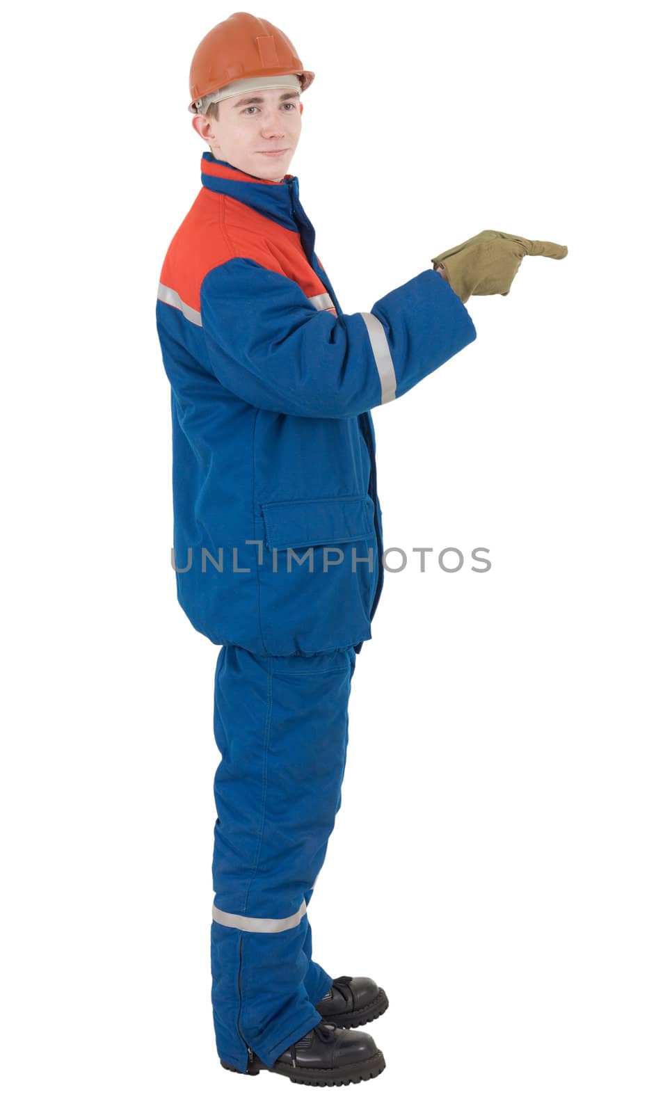 Man in overalls and helmet indicates finger aside