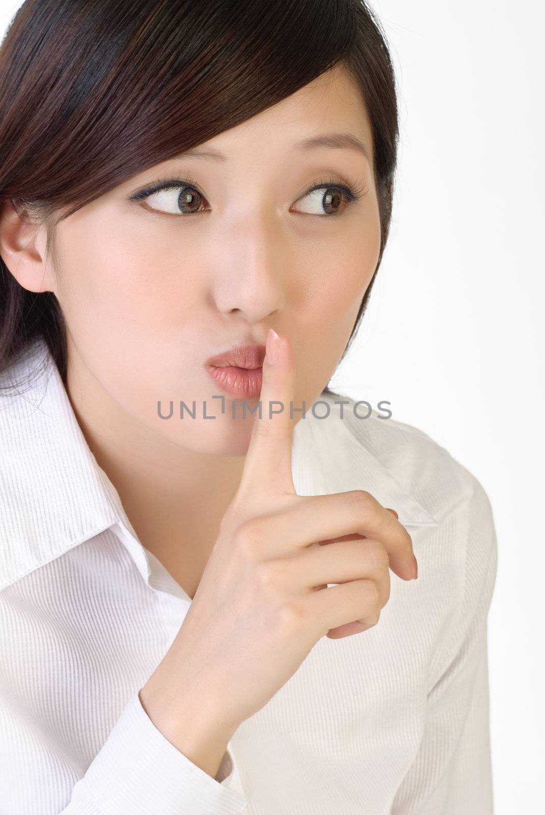 Closeup portrait of business woman with silent sign gesture on lips.
