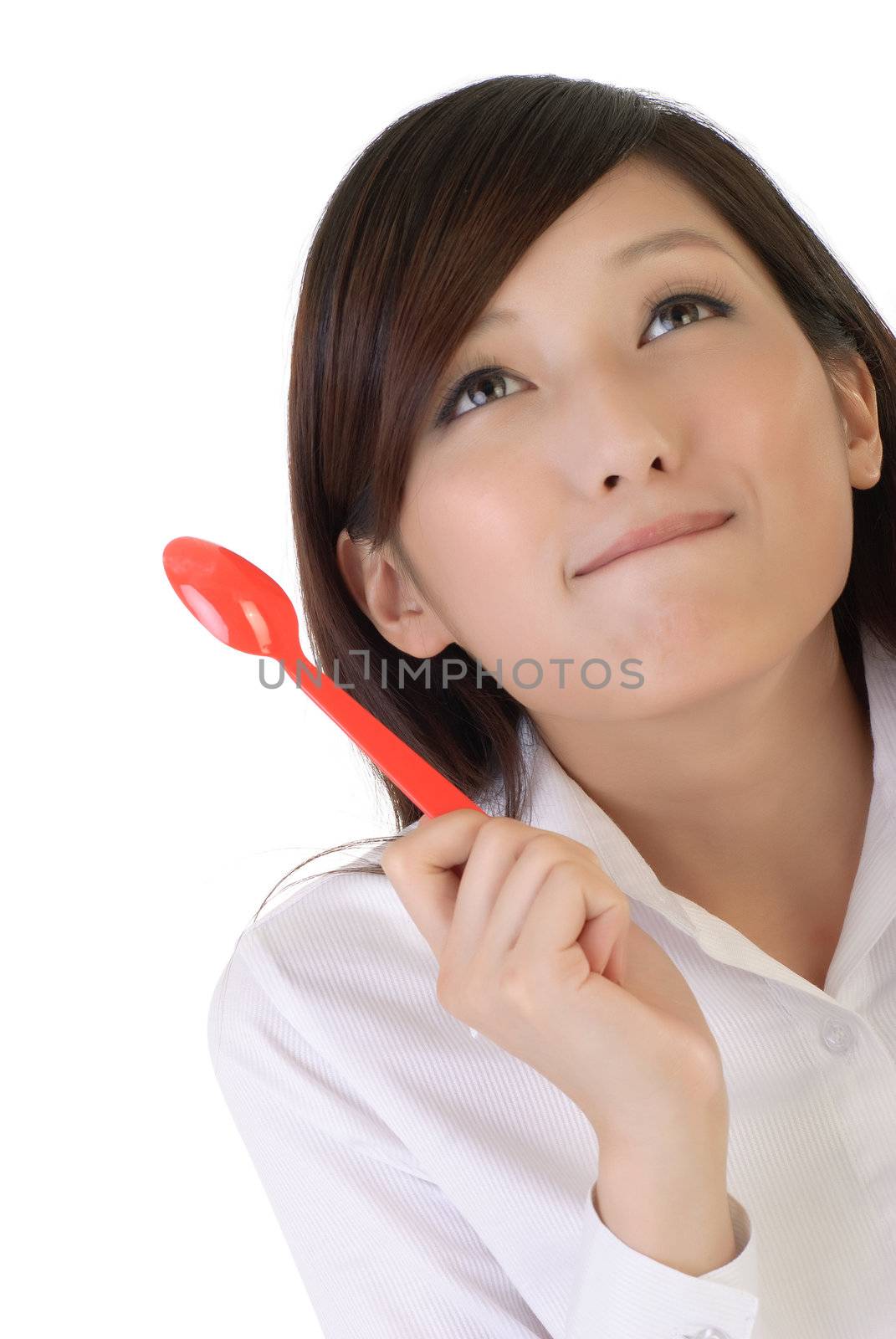 Eating concept with cute business woman holding tablespoon and smile on white background.