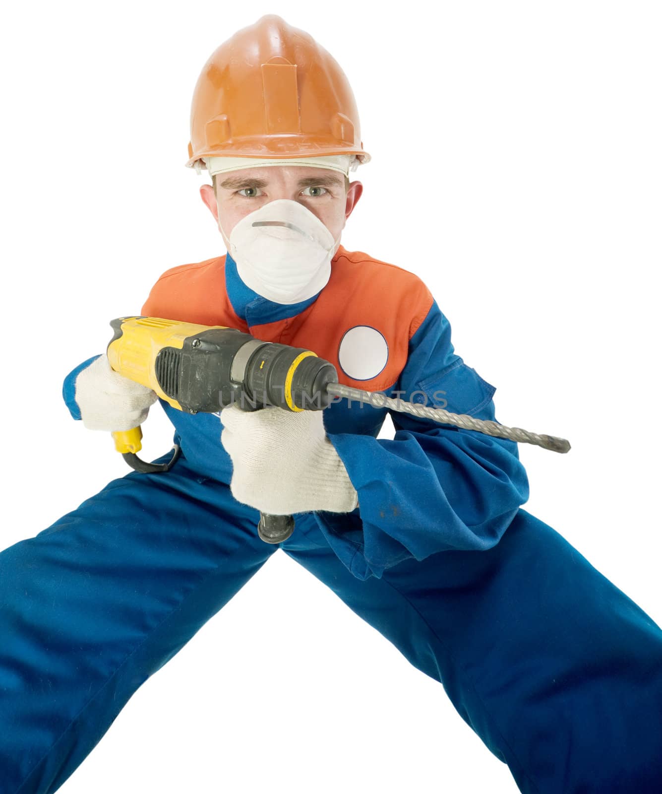 Labourer on the helmet with hand drill on a white background