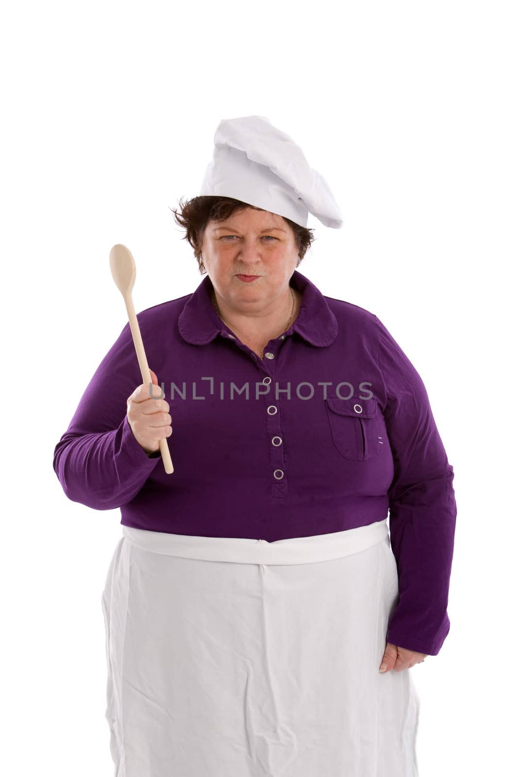 Female chef holding up her wooden spoon with a dangerous face