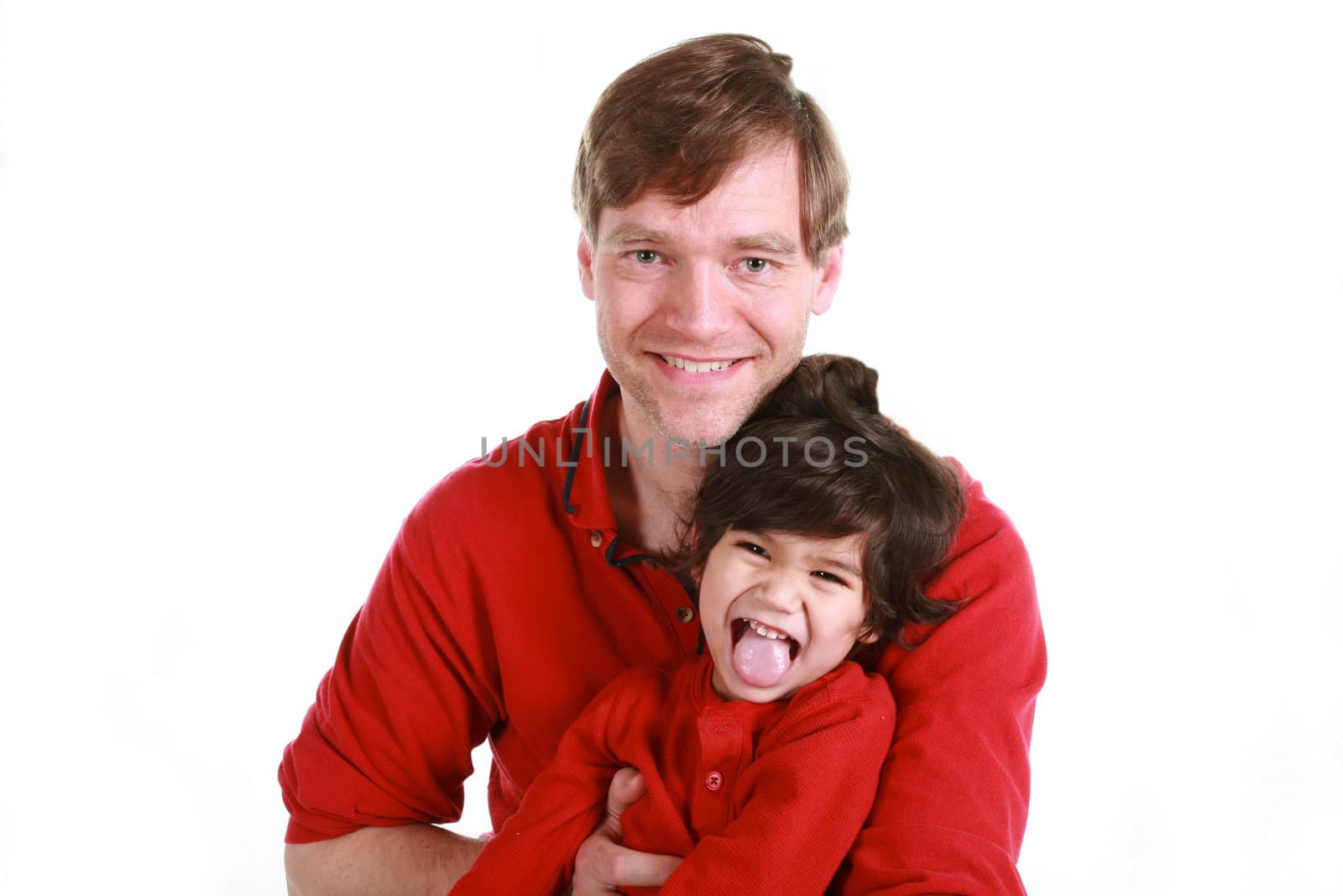 Happy father and son in red shirts isolated on white