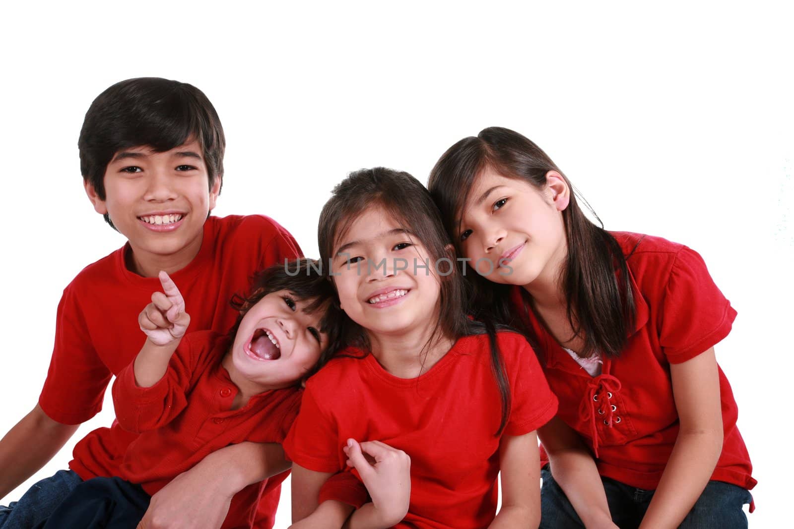 FOur siblings with red shirts isolated on white