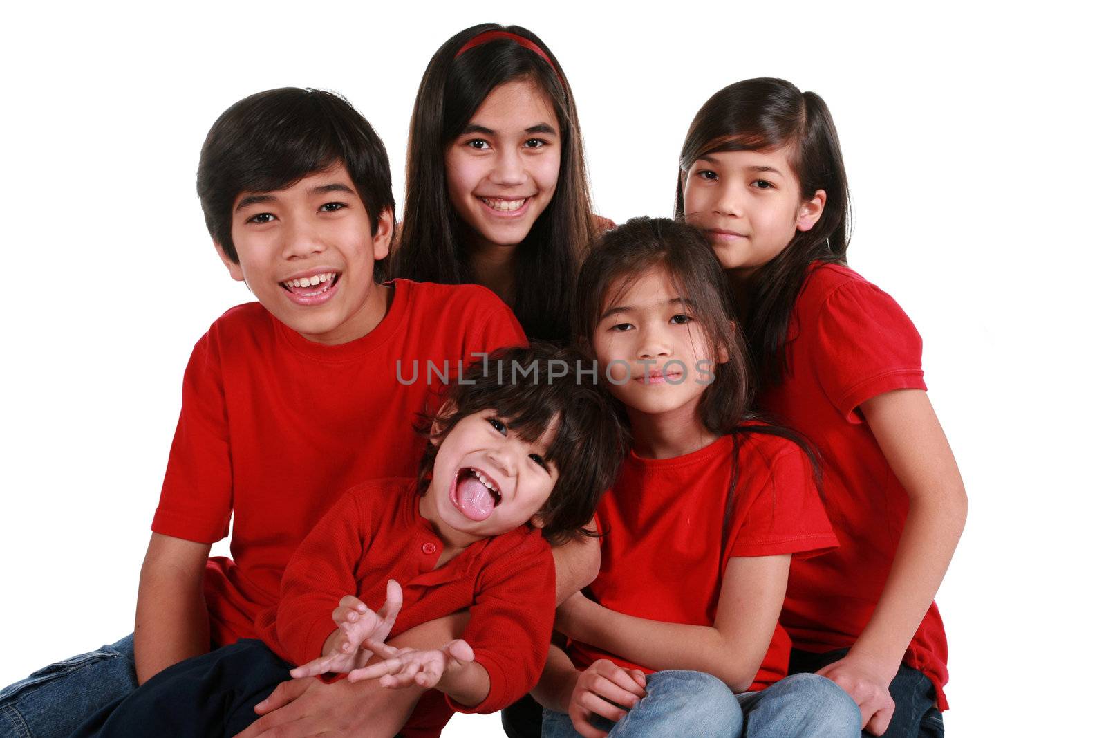 Five siblings with red shirts isolated on white