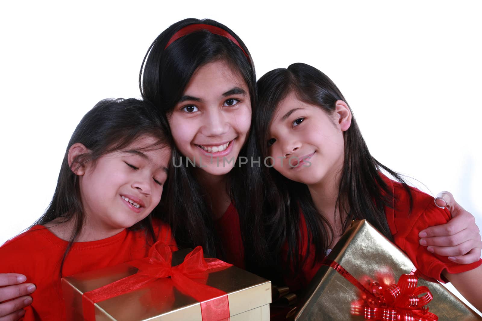 Three sisters holding presents by jarenwicklund