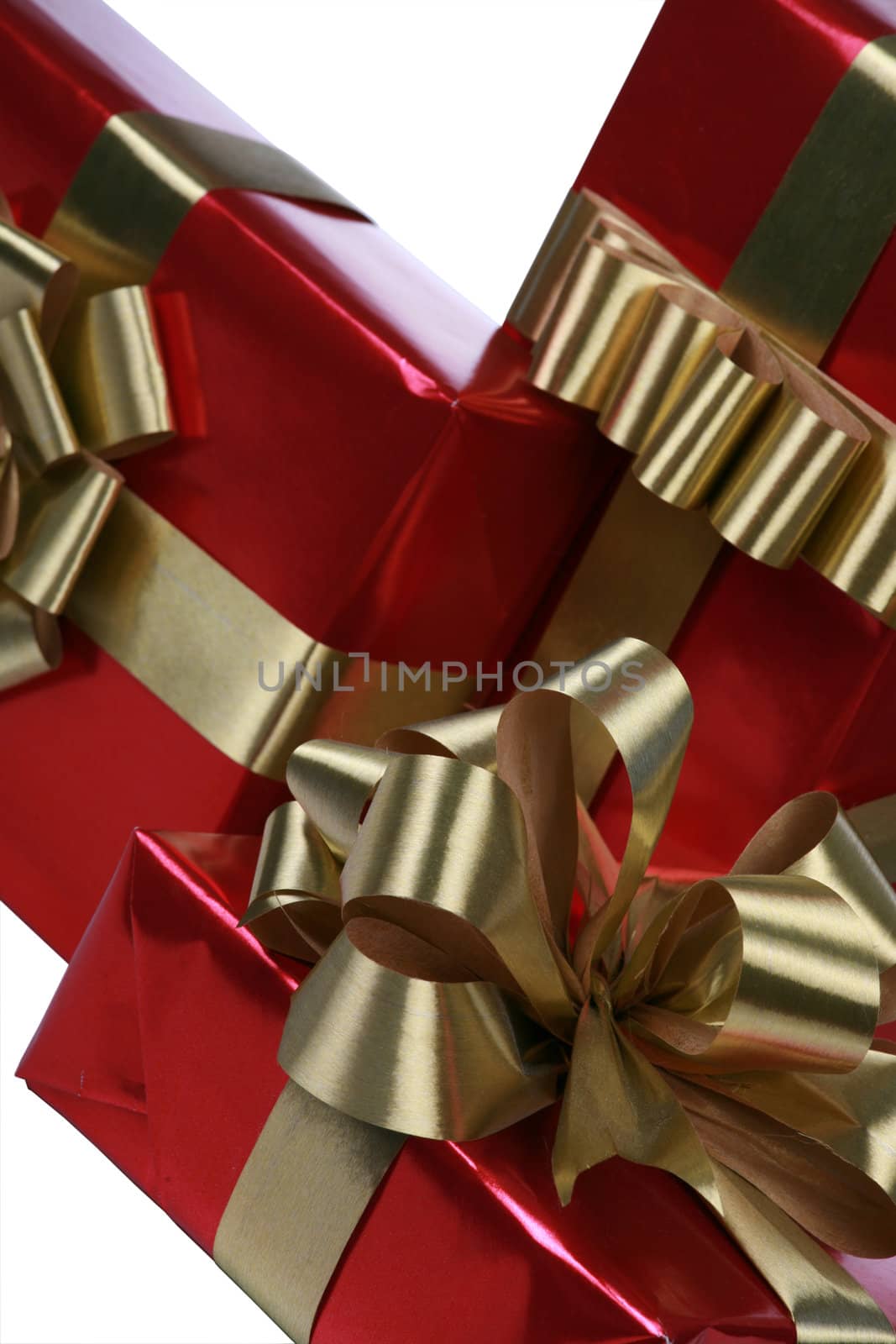 Elegant red presents with gold ribbons isolated on white