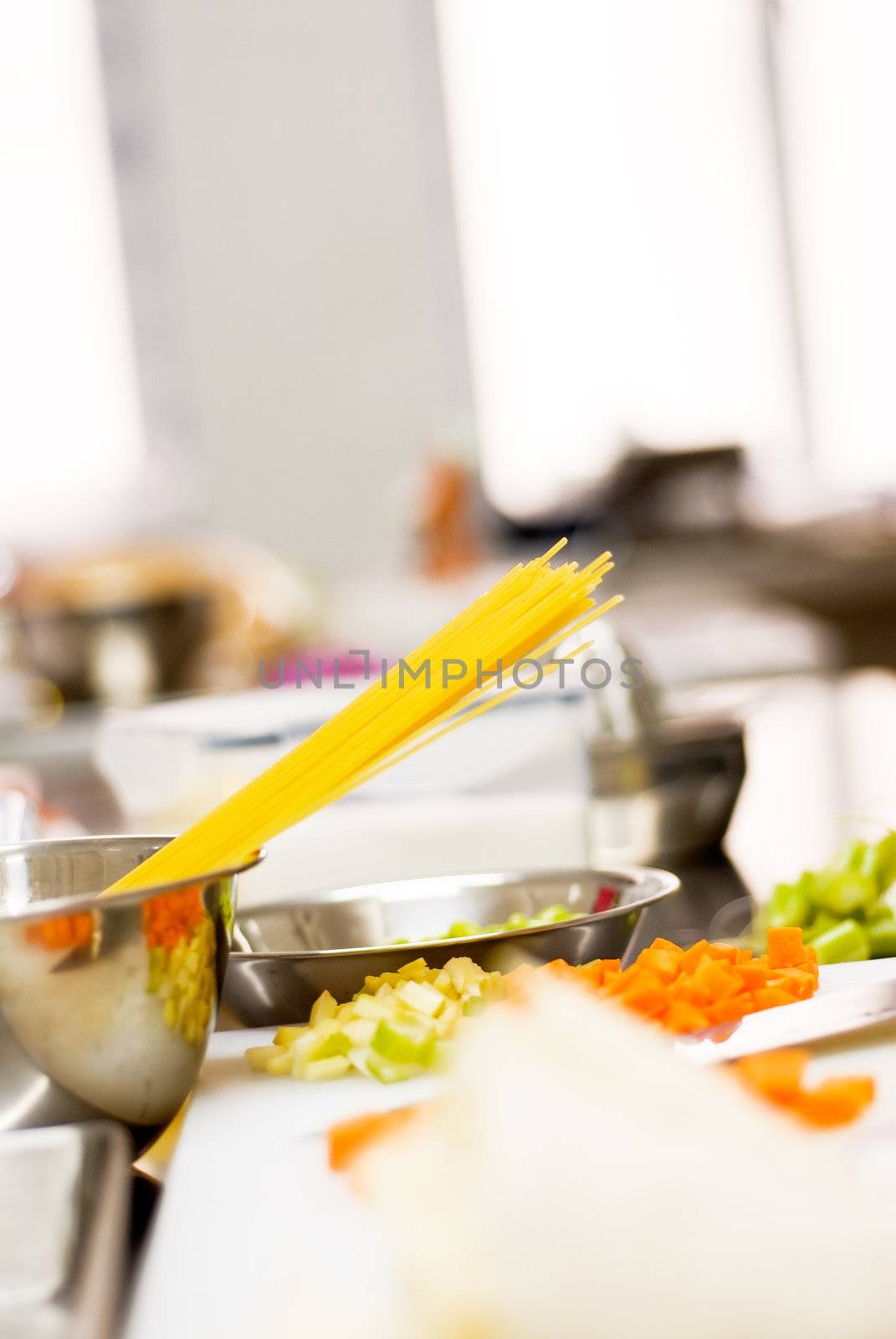 italian spaghetti pasta on a typical full equipped restaurant kitchen