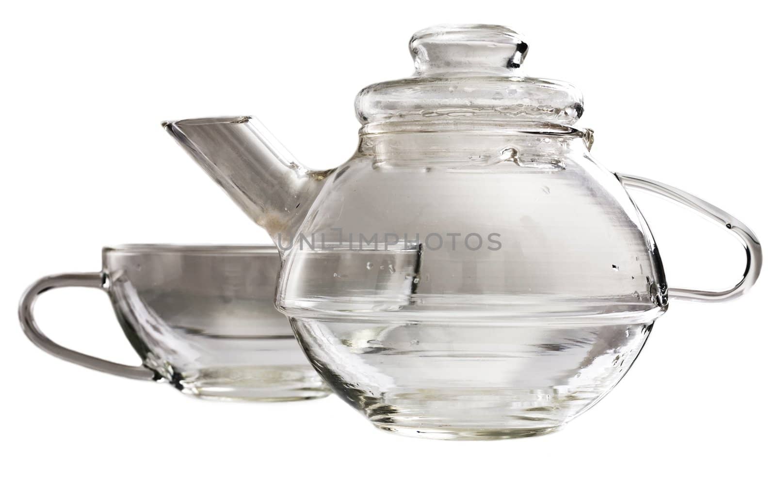 A transparent glass tea-set standing on a table