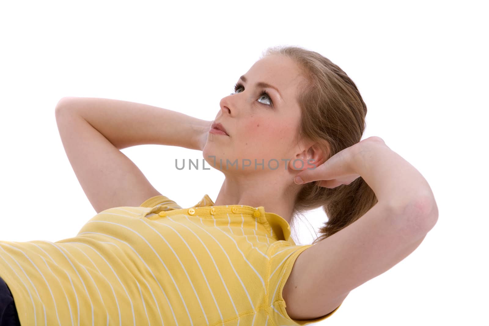 Pretty young woman doing abdominal curls on white background