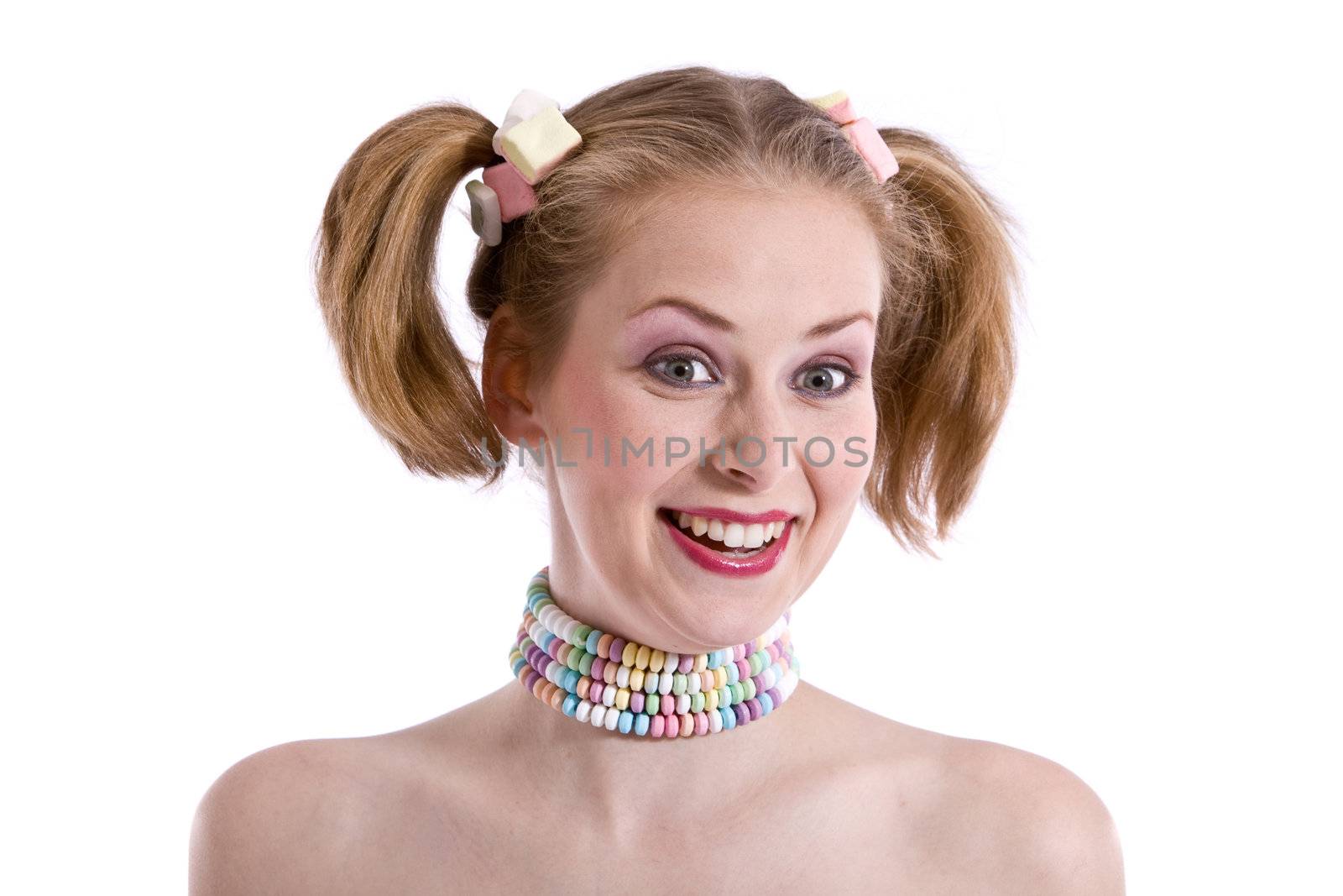 Pretty young blond girl with candy around her neck and in her hair