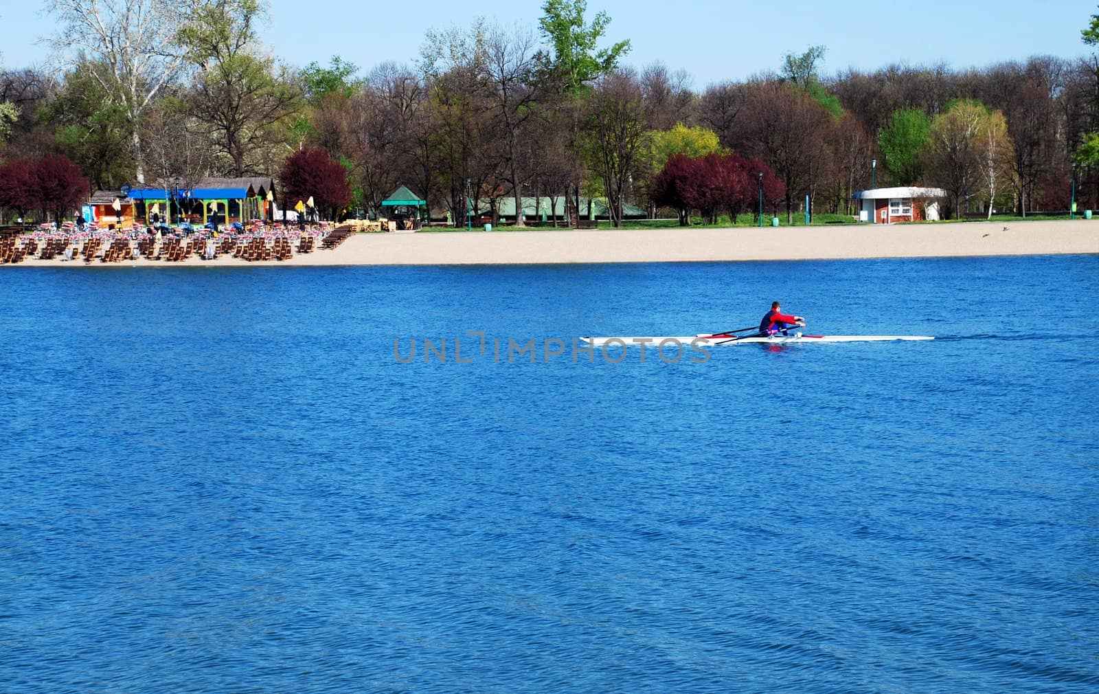 sole kayak over blue water at sunny spring morning