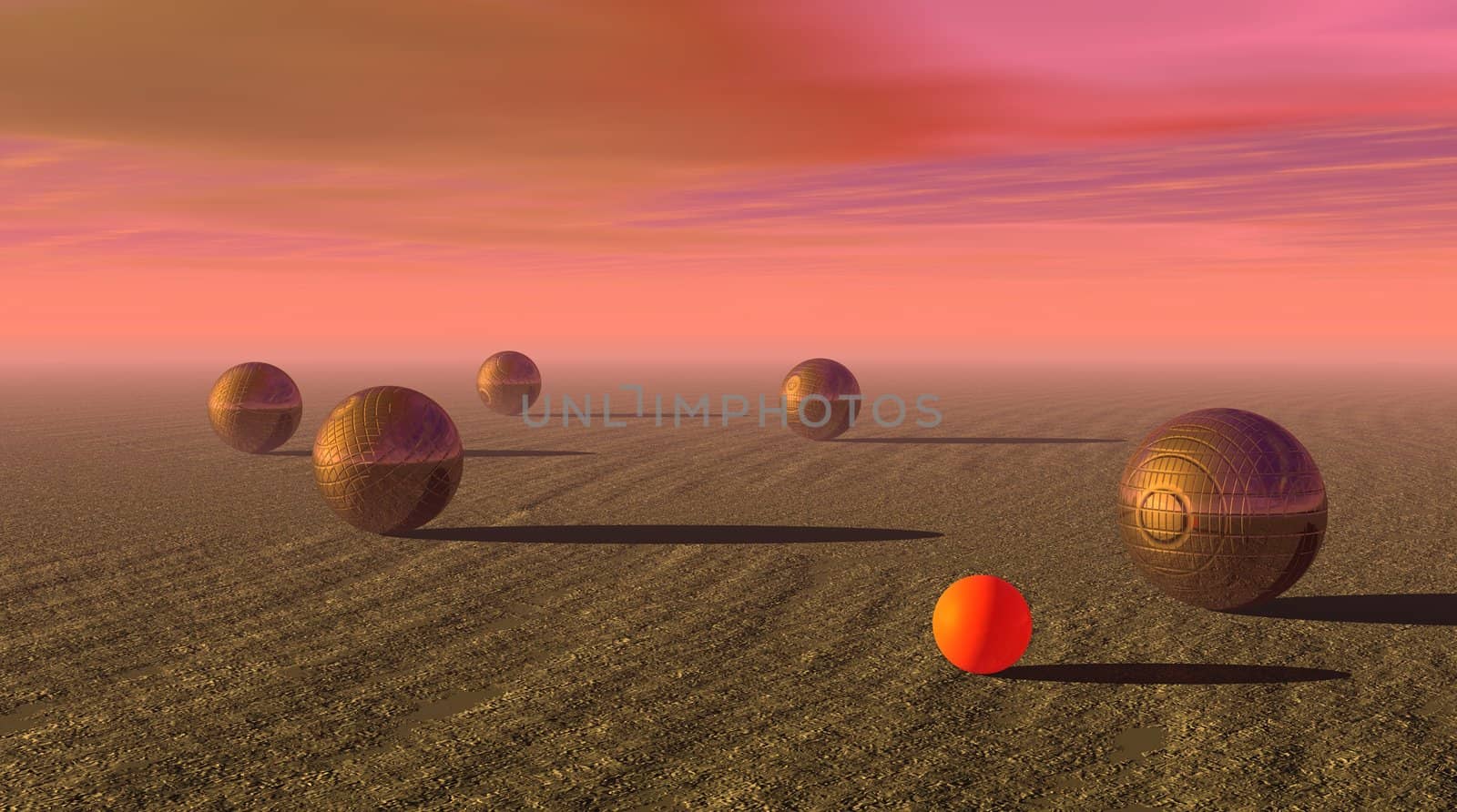 Five metallic petanque balls and the small orange jack on the ground by beautiful sunset