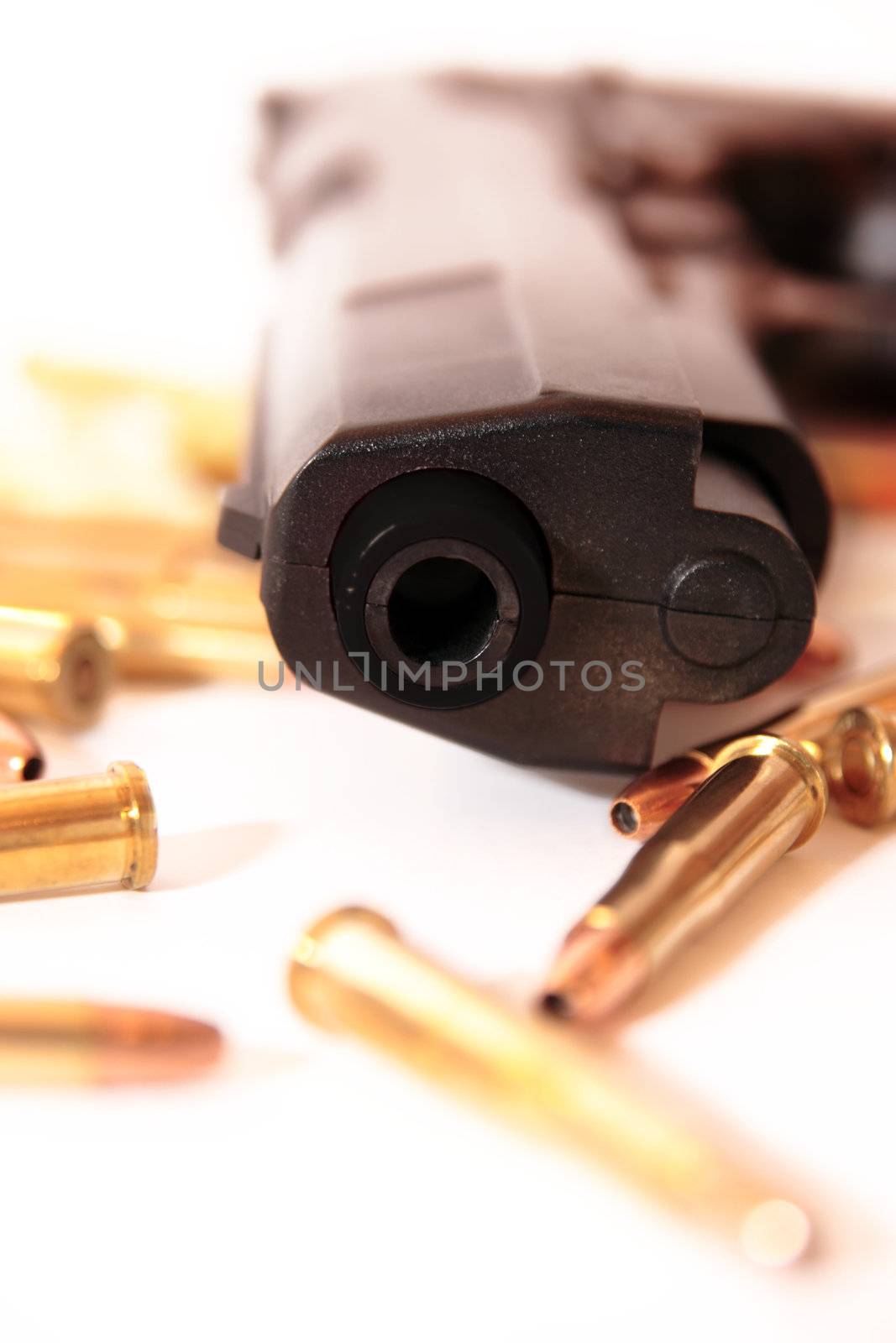 gold ammo and a handgun depicting gun culture