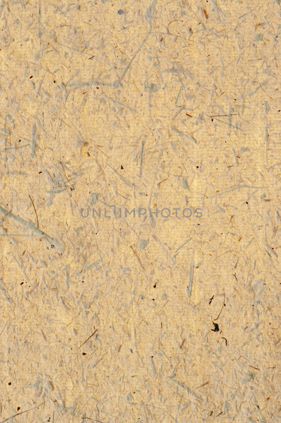 Detail of the rough surface of the handmade paper with remains of plants - natural product