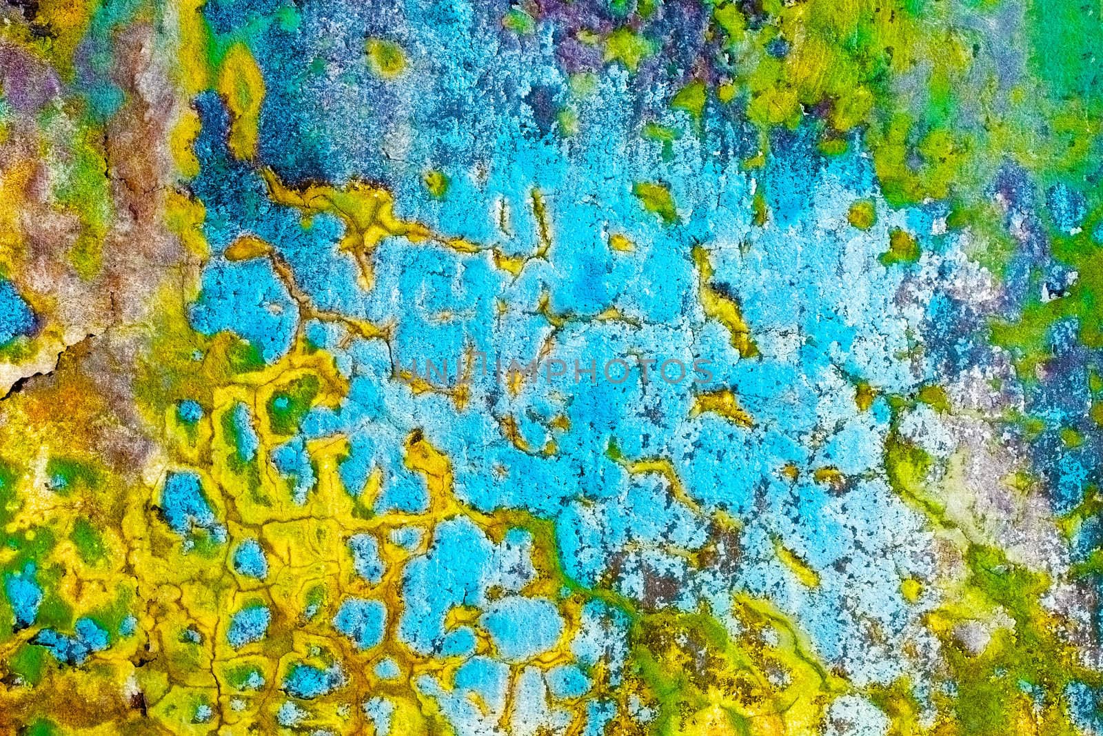 The old dirty multicolor peeling concrete wall