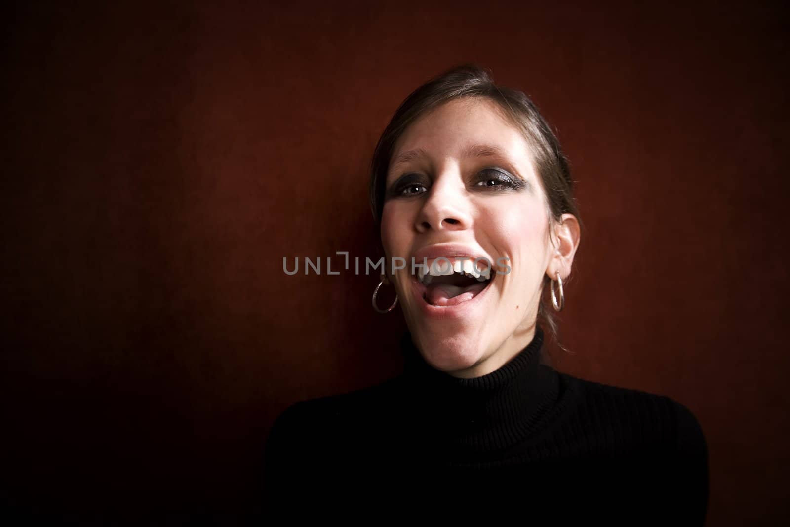 Pretty Woman Laughing in a Black Turtleneck