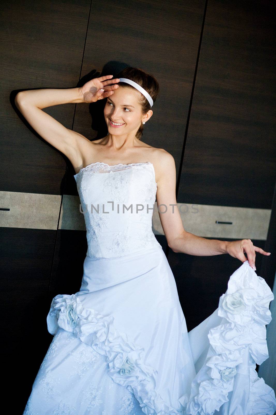 a bride playes with her dress