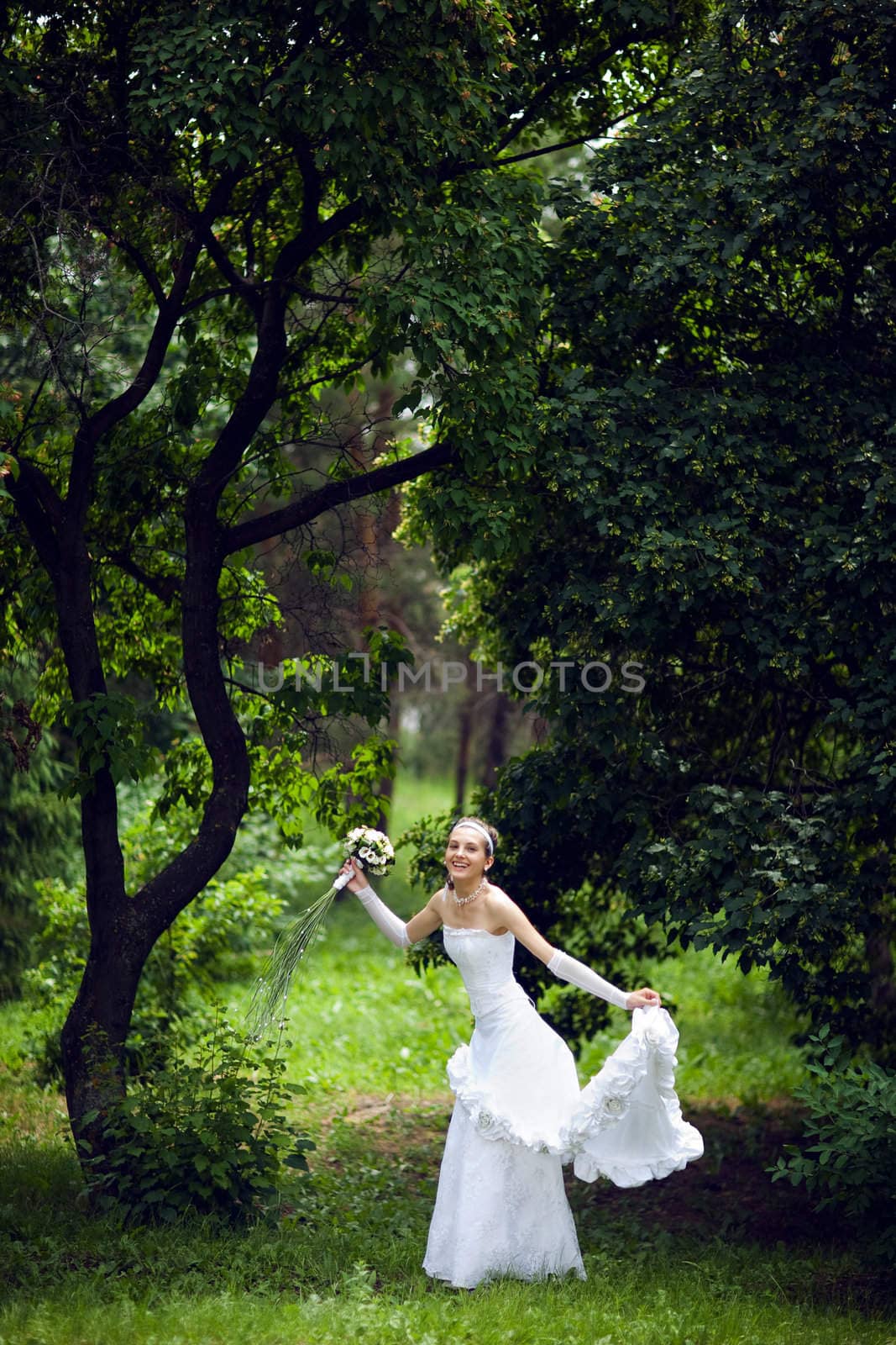 a bride near the tree