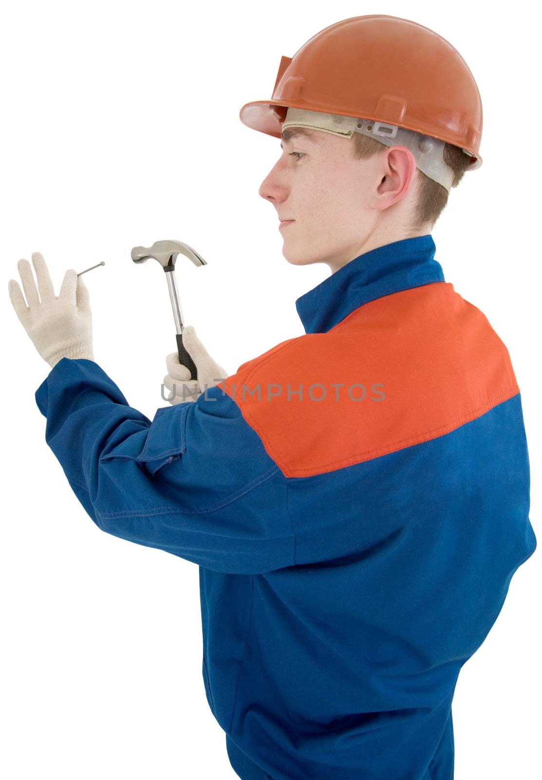 Man in worker cloth with hammer and nail