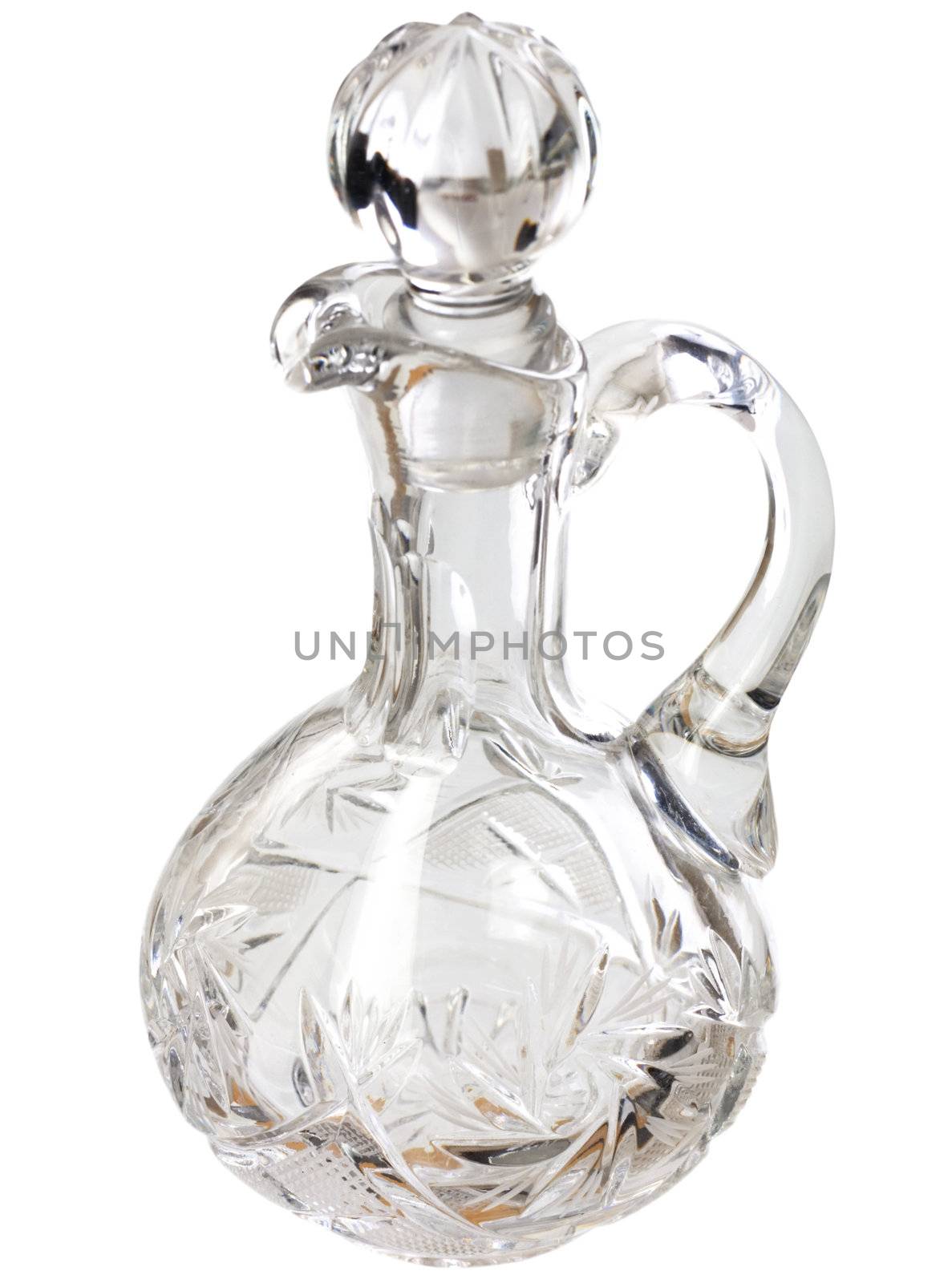 The glass transparent figured carafe isolated on a white background