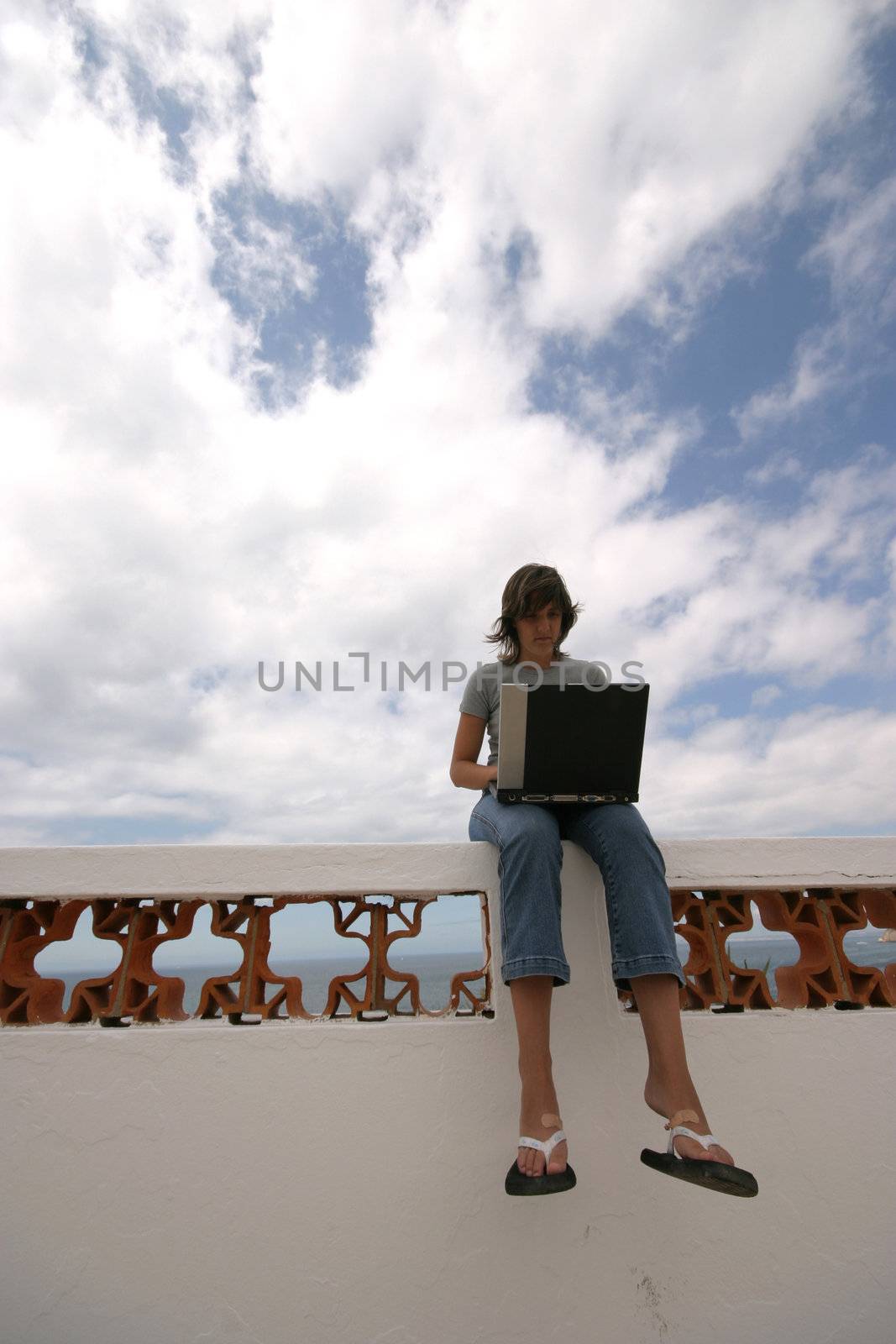 man working with laptop on the coast