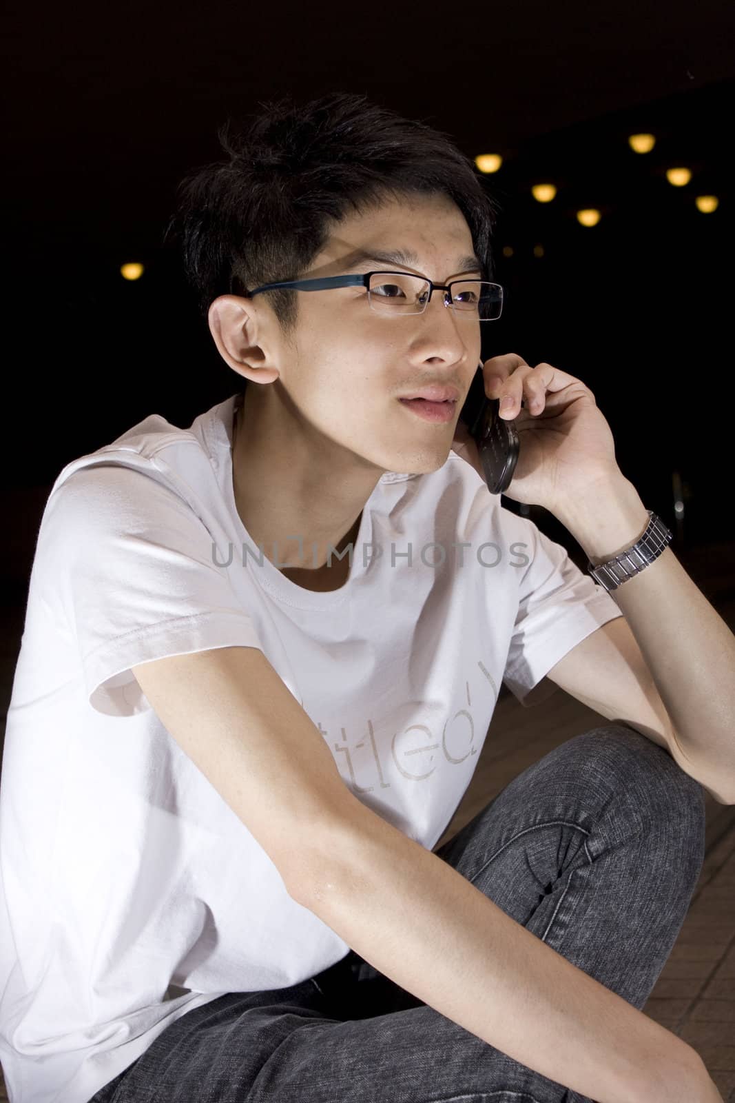 Asia young man talking phone
