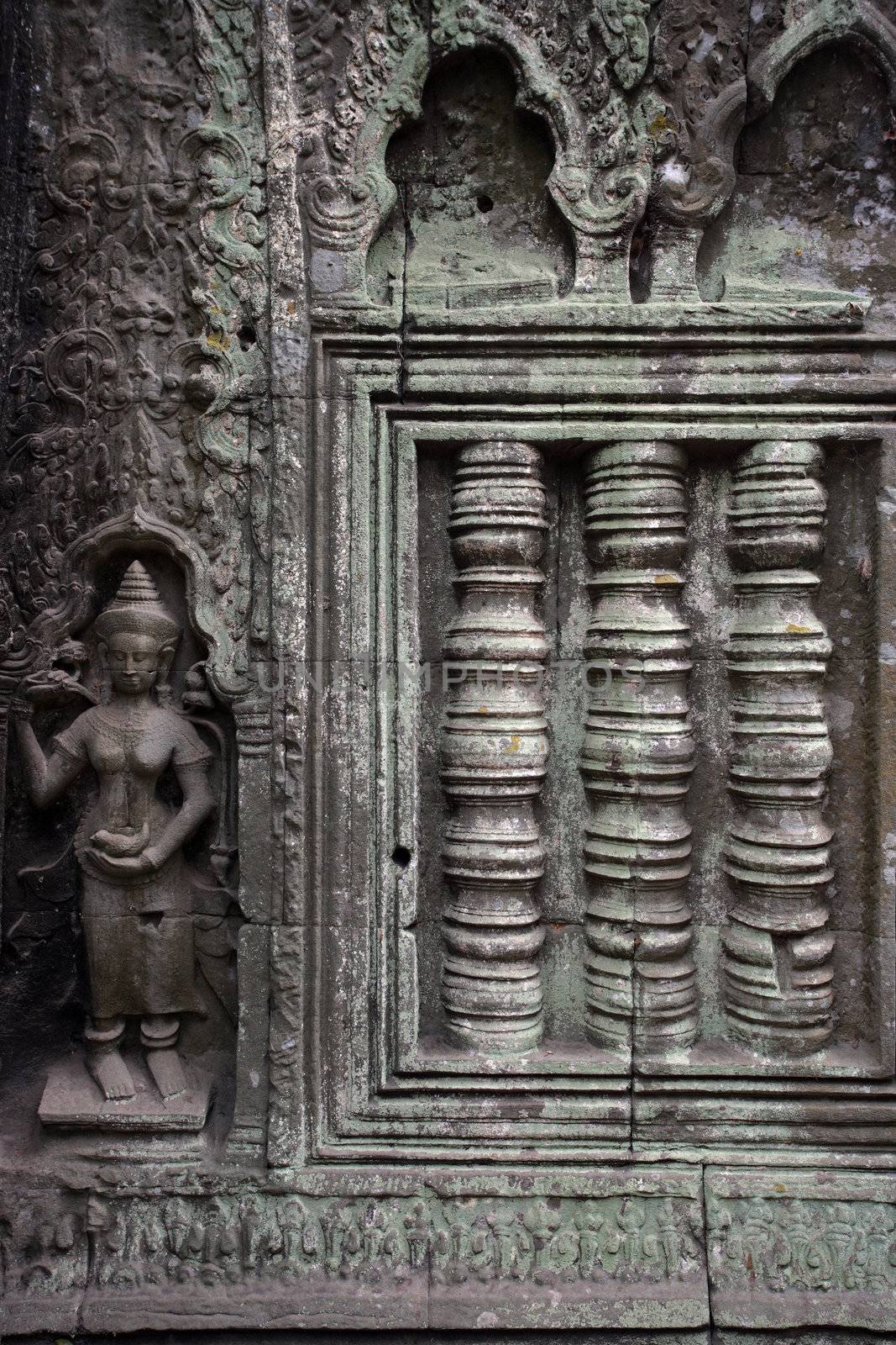 A carved wall of the Angkor temples in Siem Reap, Cambodia.
