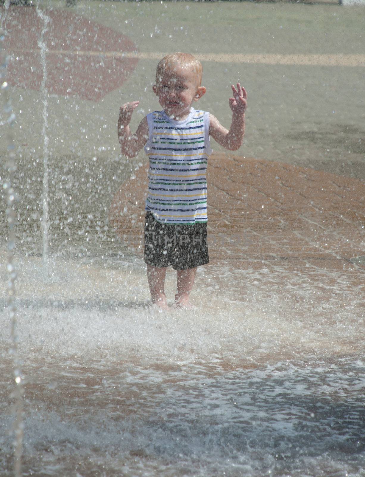 young child having fun and playing in the park on a sunny day