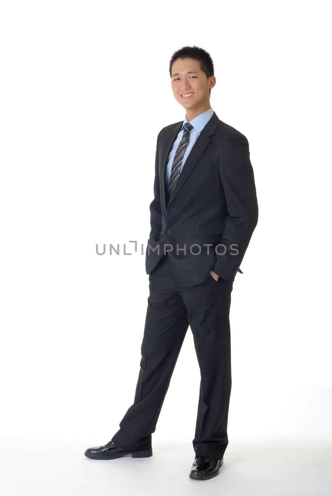 Successful young business man of Asian, full length portrait isolated on white.