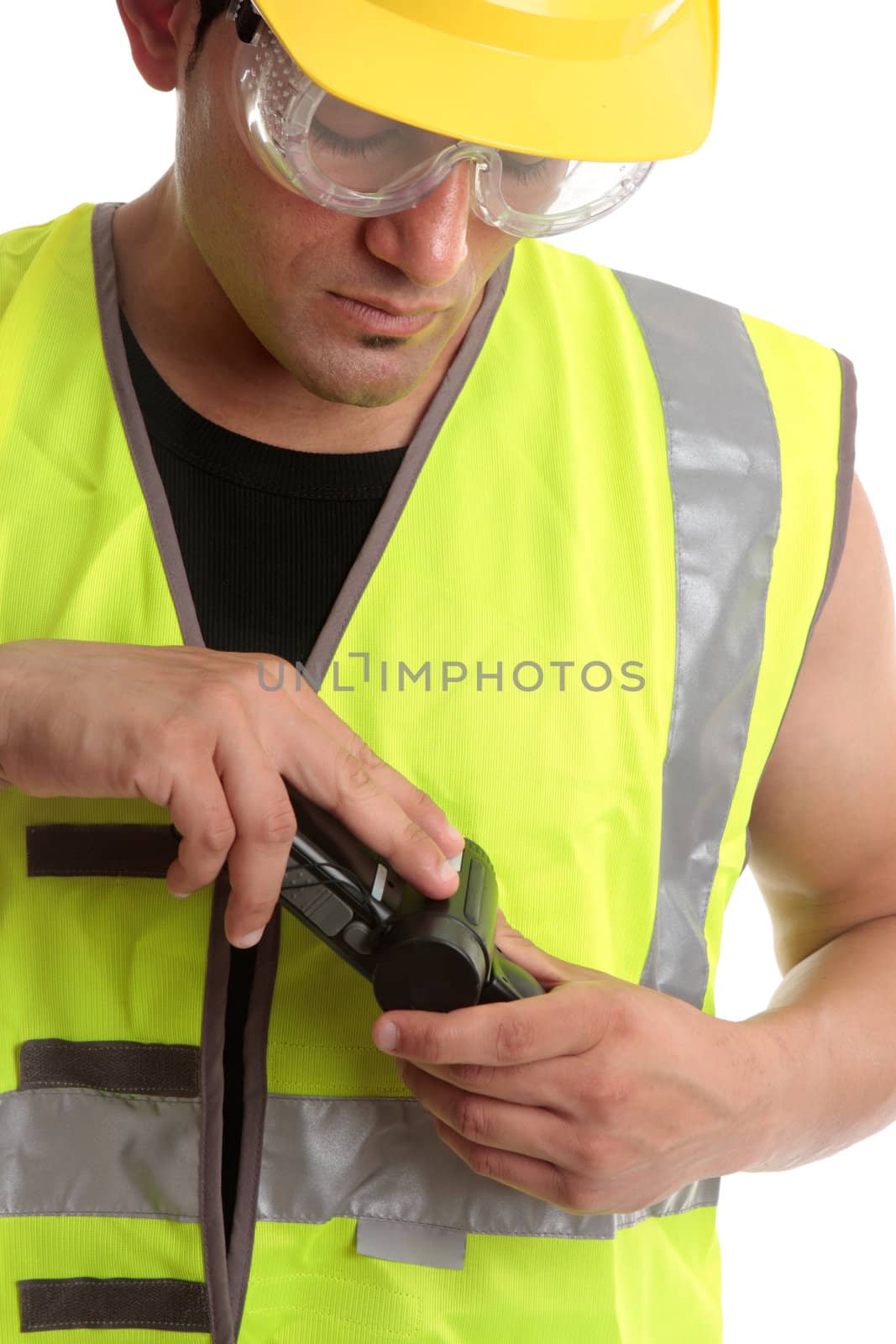 A builder construction worker holding a measuring device