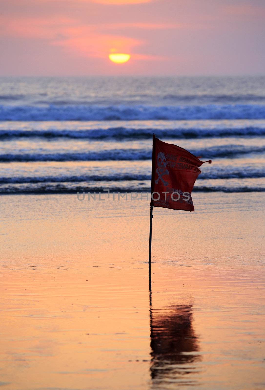 Swimming prohibited around this area flag in Kuta beach Bali