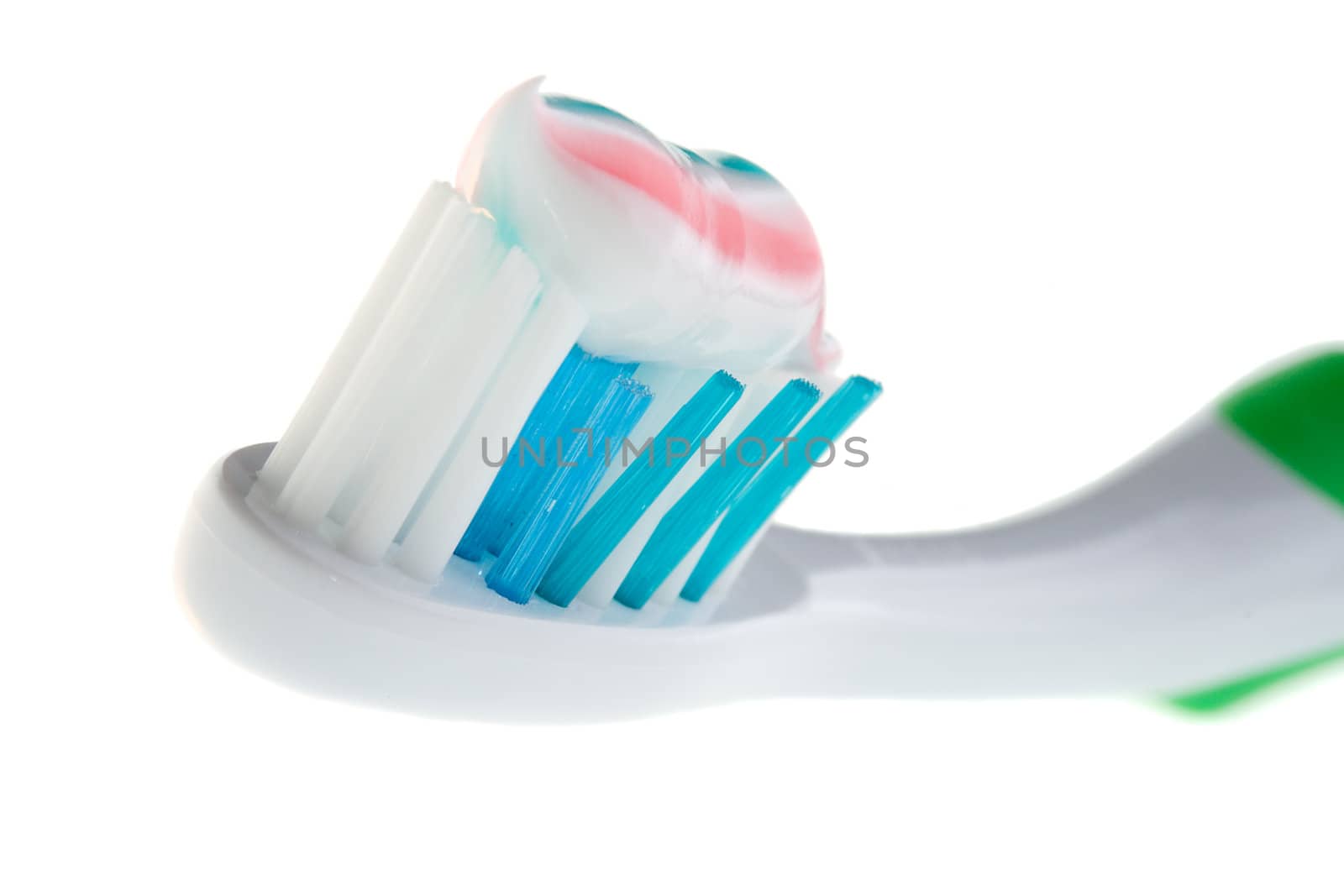 close-up tooth-brush with color paste, isolated on white