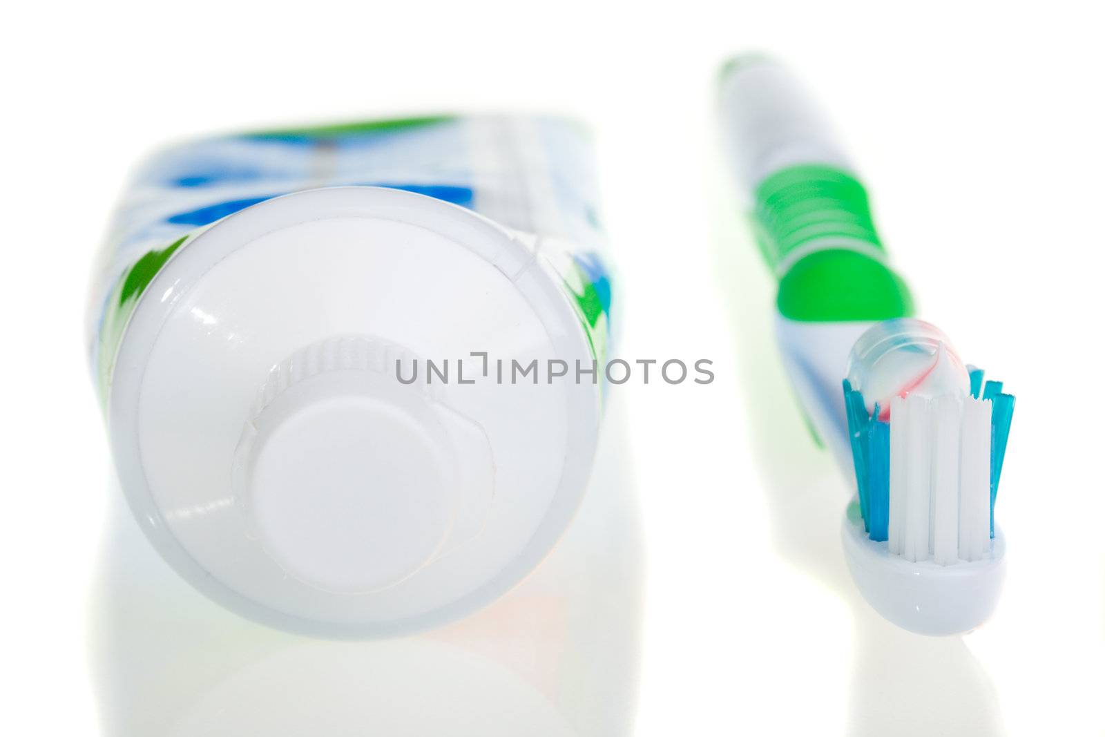 tooth-brush and tube of toothpaste, isolated on white