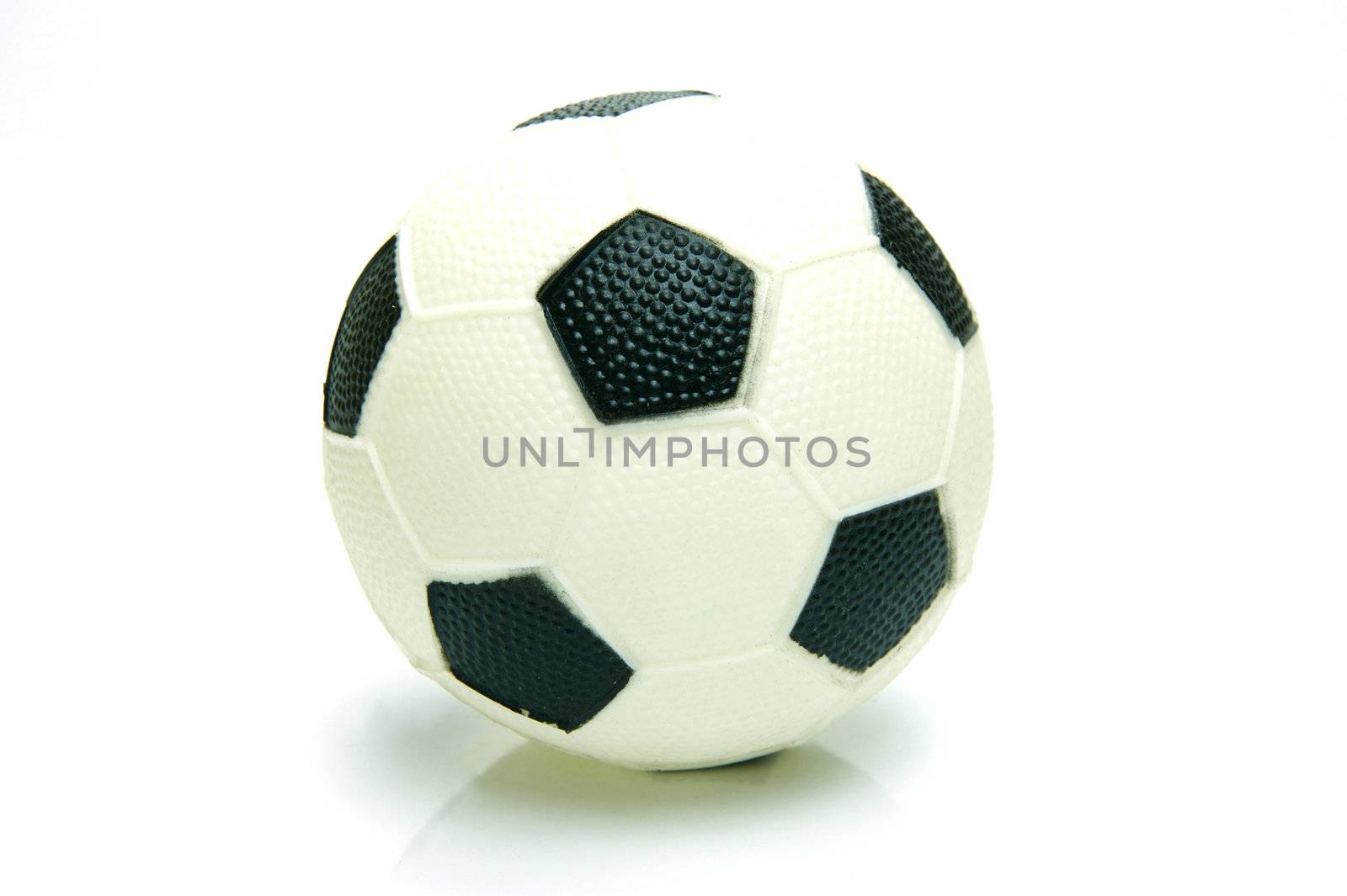 A soccer ball isolated against a green background