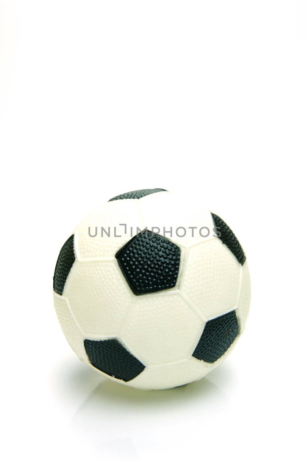 A soccer ball isolated against a green background