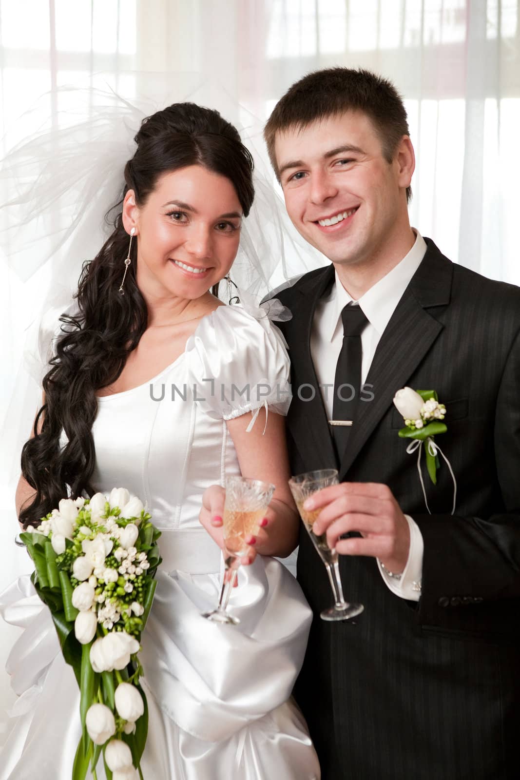 bride and groom with champagne by vsurkov