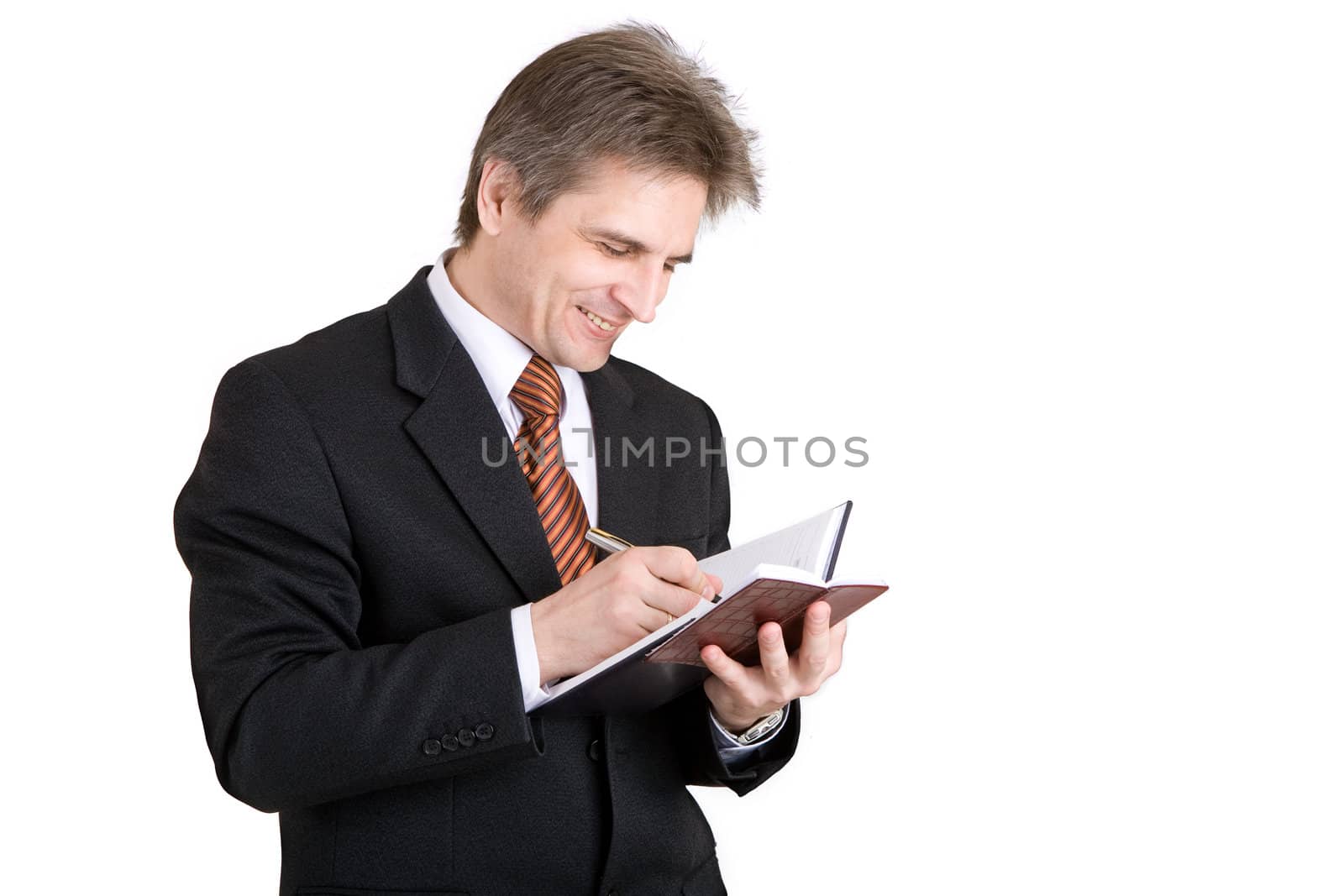 businessman writing something in his notebook