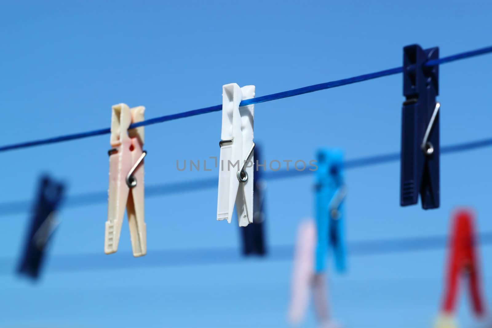 cloth pegs with a under the blue sky  by artush