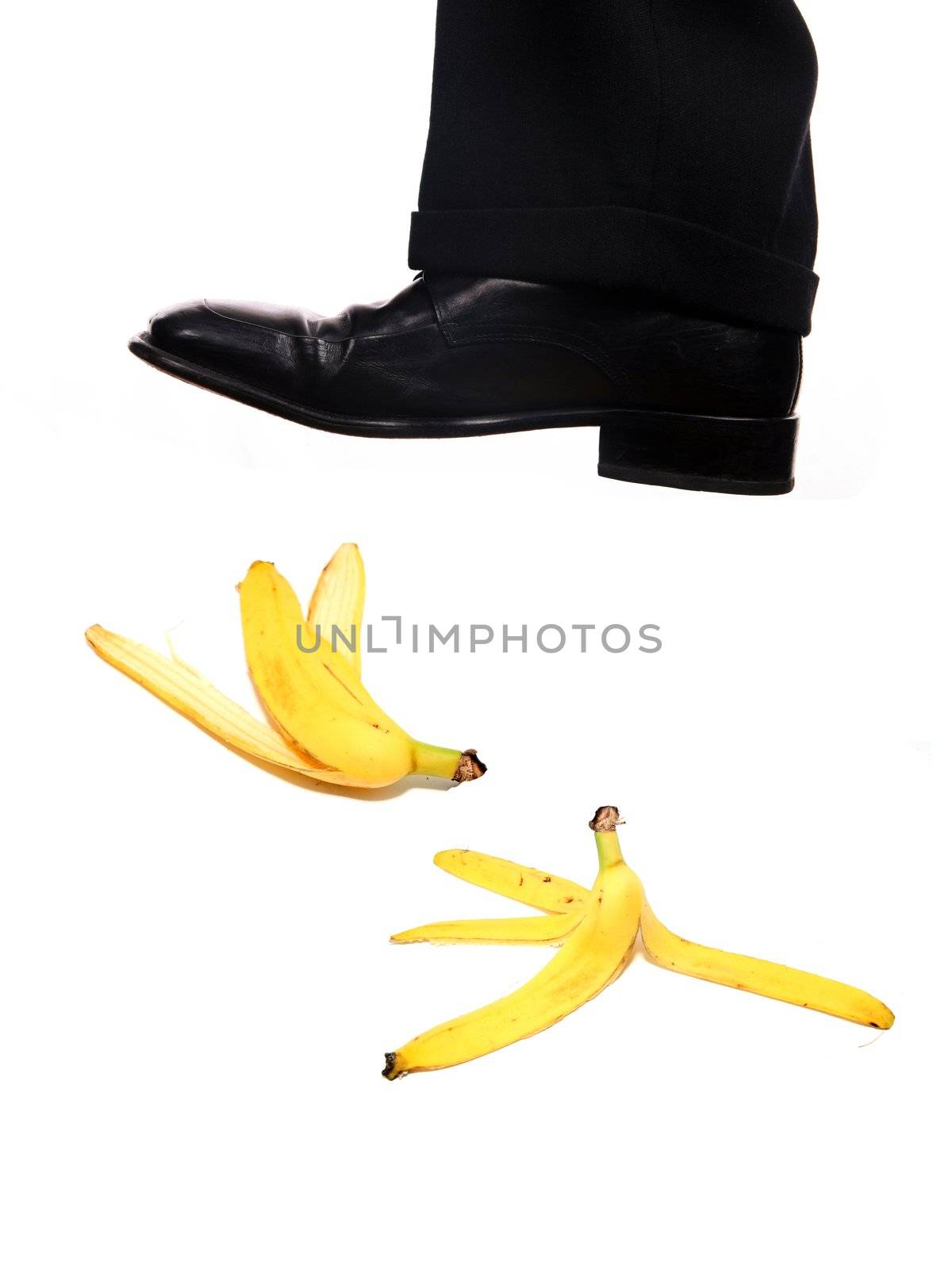 businessman shoe steping a banana