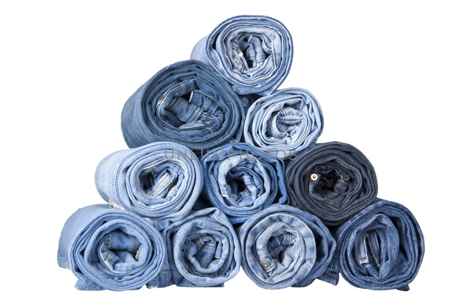 roll blue denim jeans arranged in stack