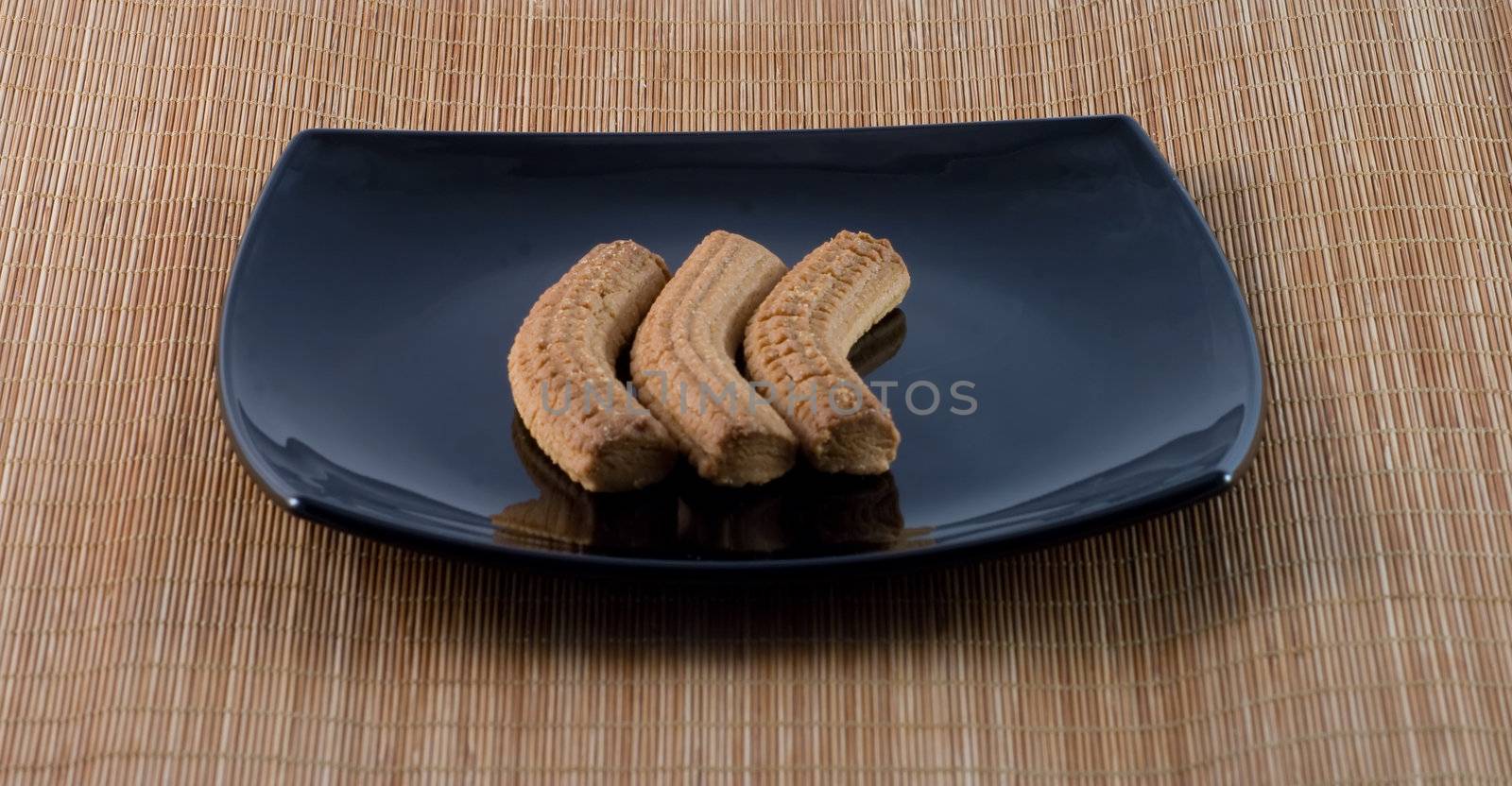 Typical Italian biscuits on a black plate