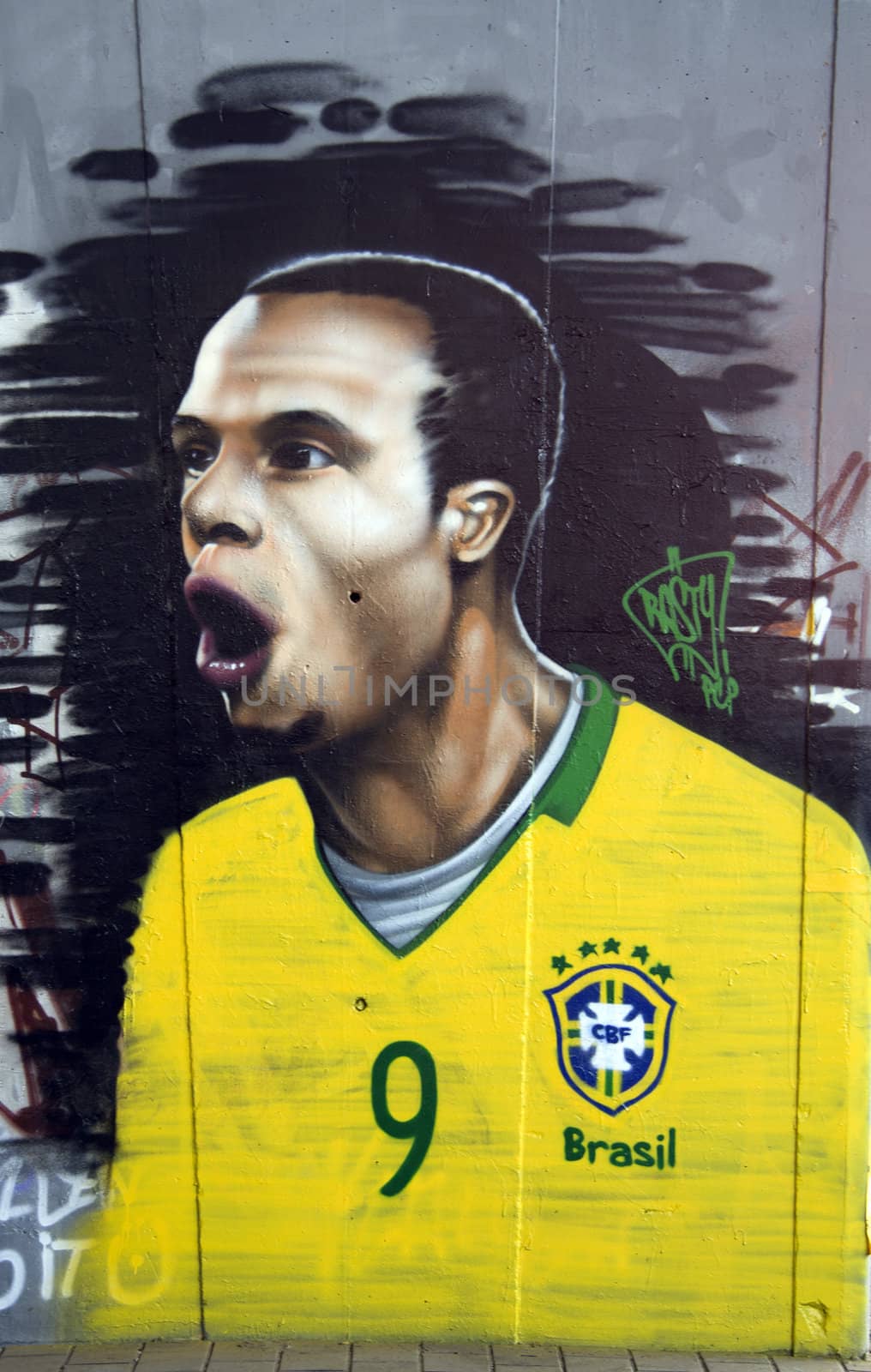 Graffiti on a wall depicting a brazilian football player
