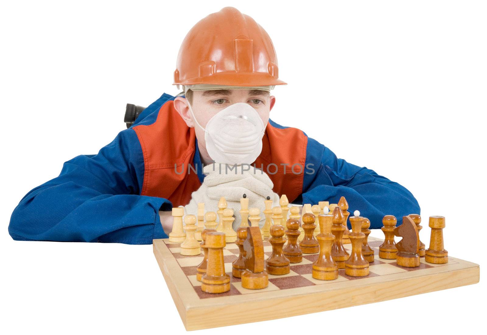 Builder and chess board on the white background