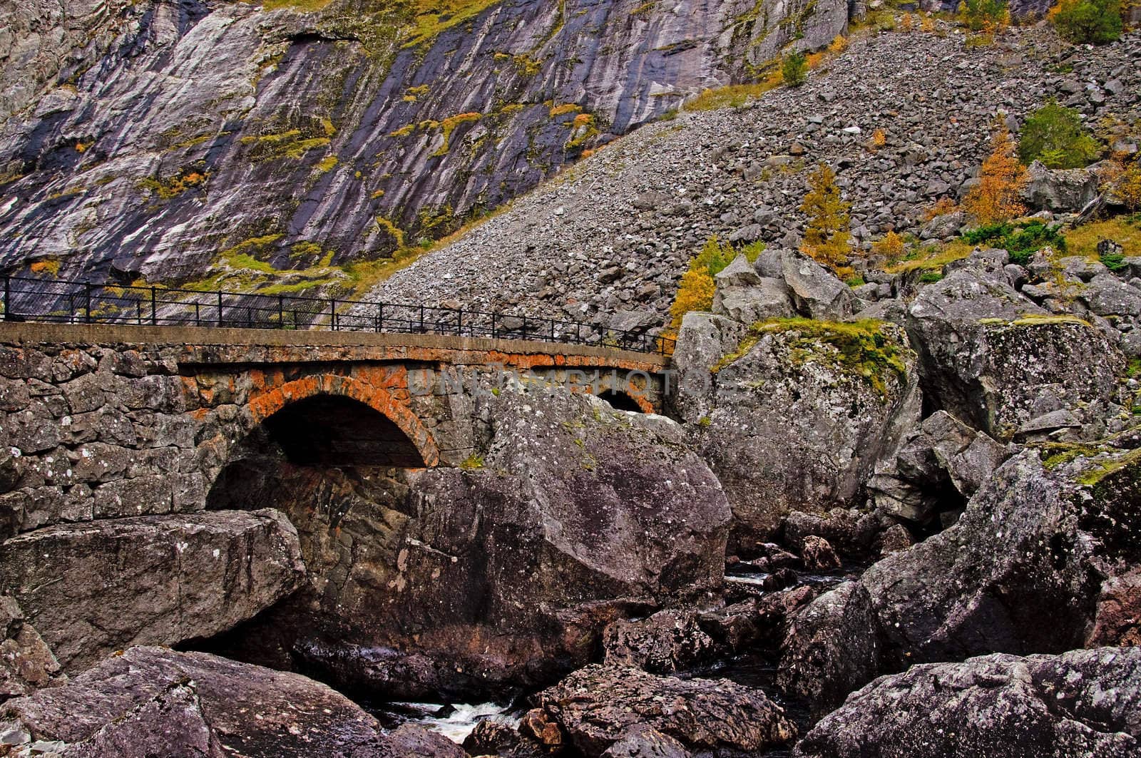 Stone bridge in a rocky valley by GryT