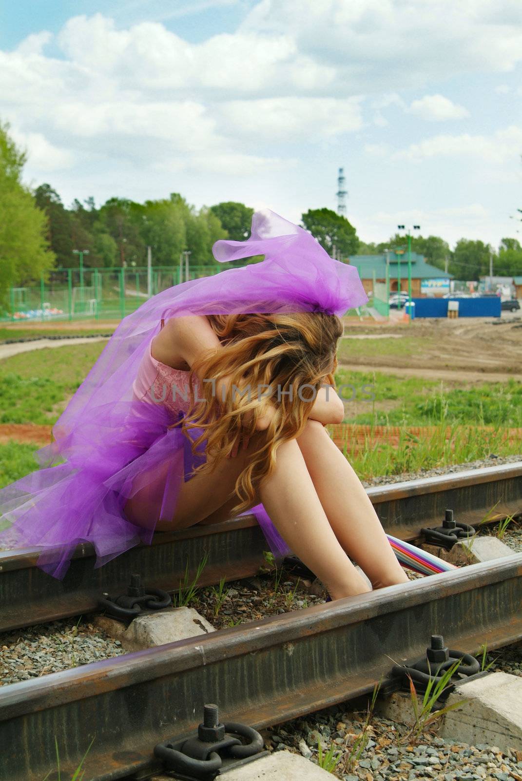 beauty girl sitting on the rail. Suicide.