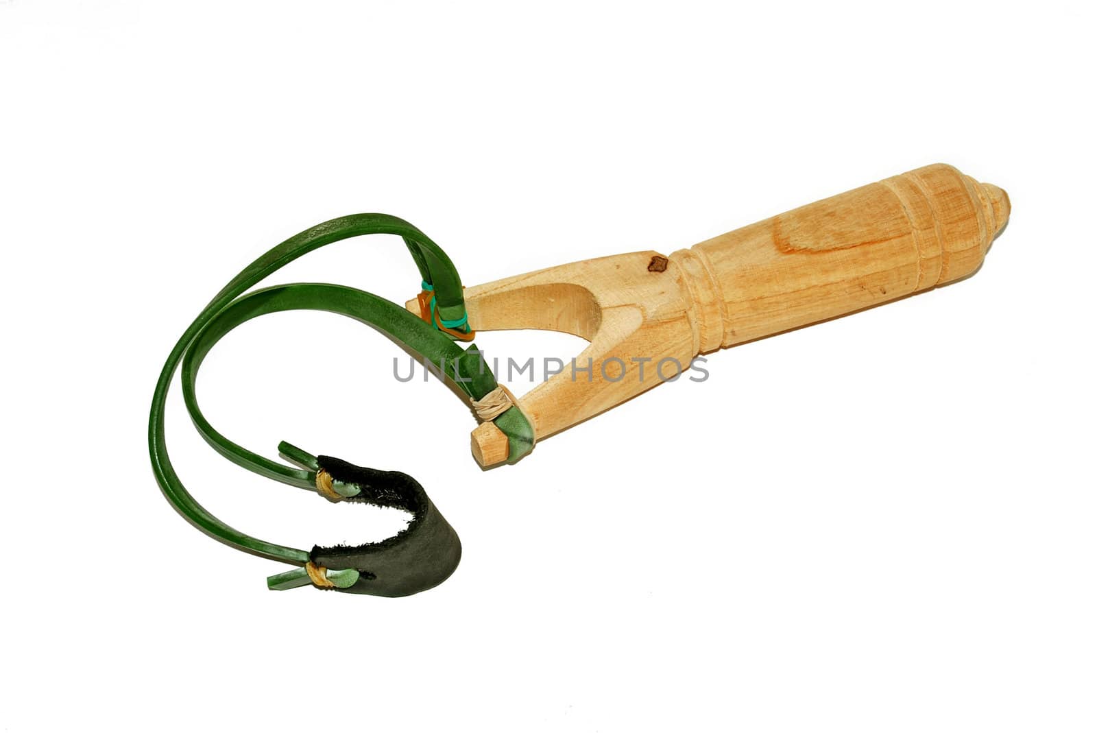 wooden slingshot with green ribbon isolated over white